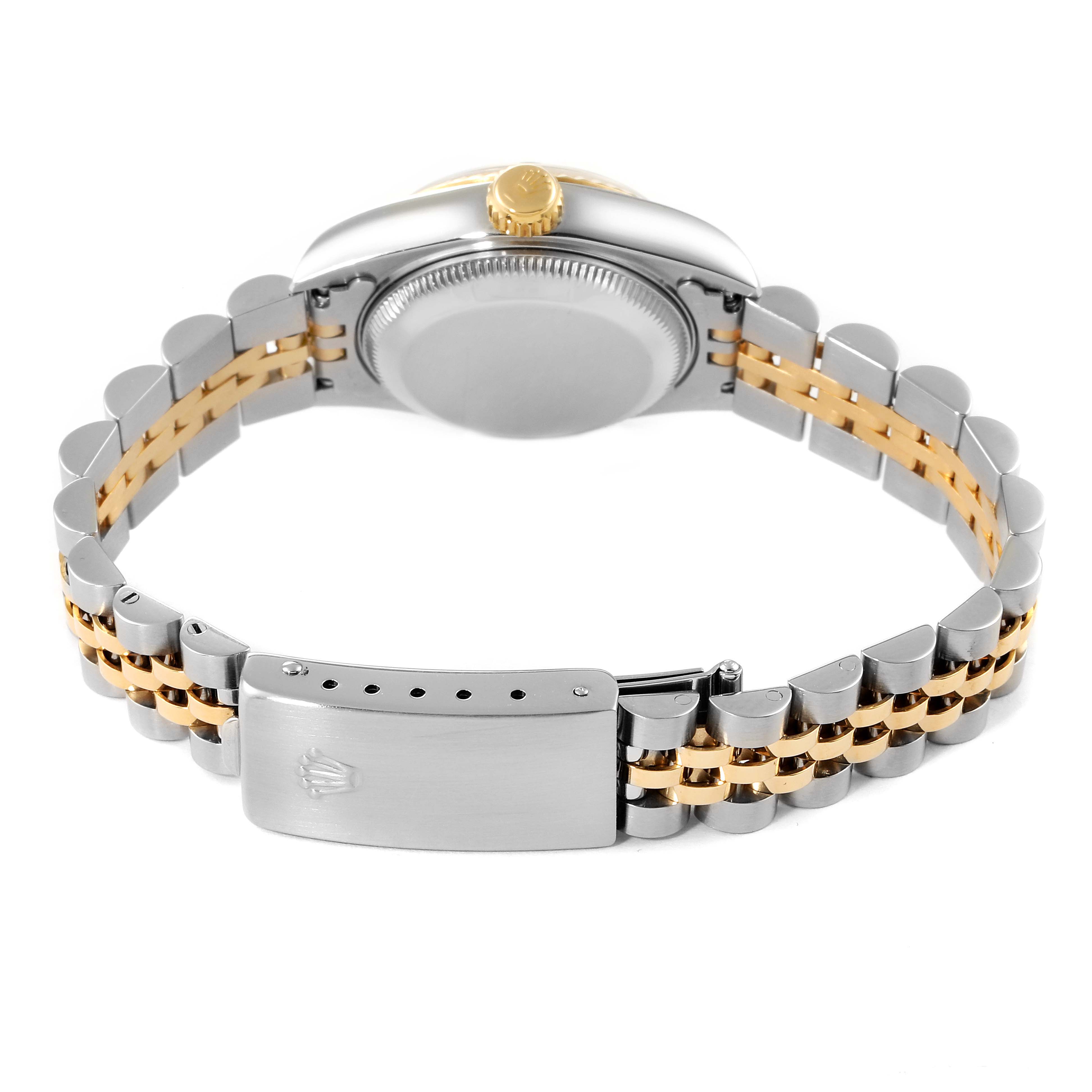 The Rolex Datejust 69173 Women
s Steel and Gold (two tone) Silver Dial 69173 Women
s Steel and Gold (two tone) Silver Dial watch is shown from the rear, highlighting the case, crown, and two-tone Jubilee bracelet with a clasp.