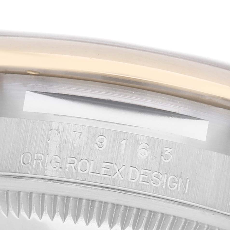 The image shows a close-up of the side of a Rolex Datejust 279163 Women's Steel and Gold (two tone) Silver Dial 279163 Women's Steel and Gold (two tone) Silver Dial watch, focusing on the engraved design details.