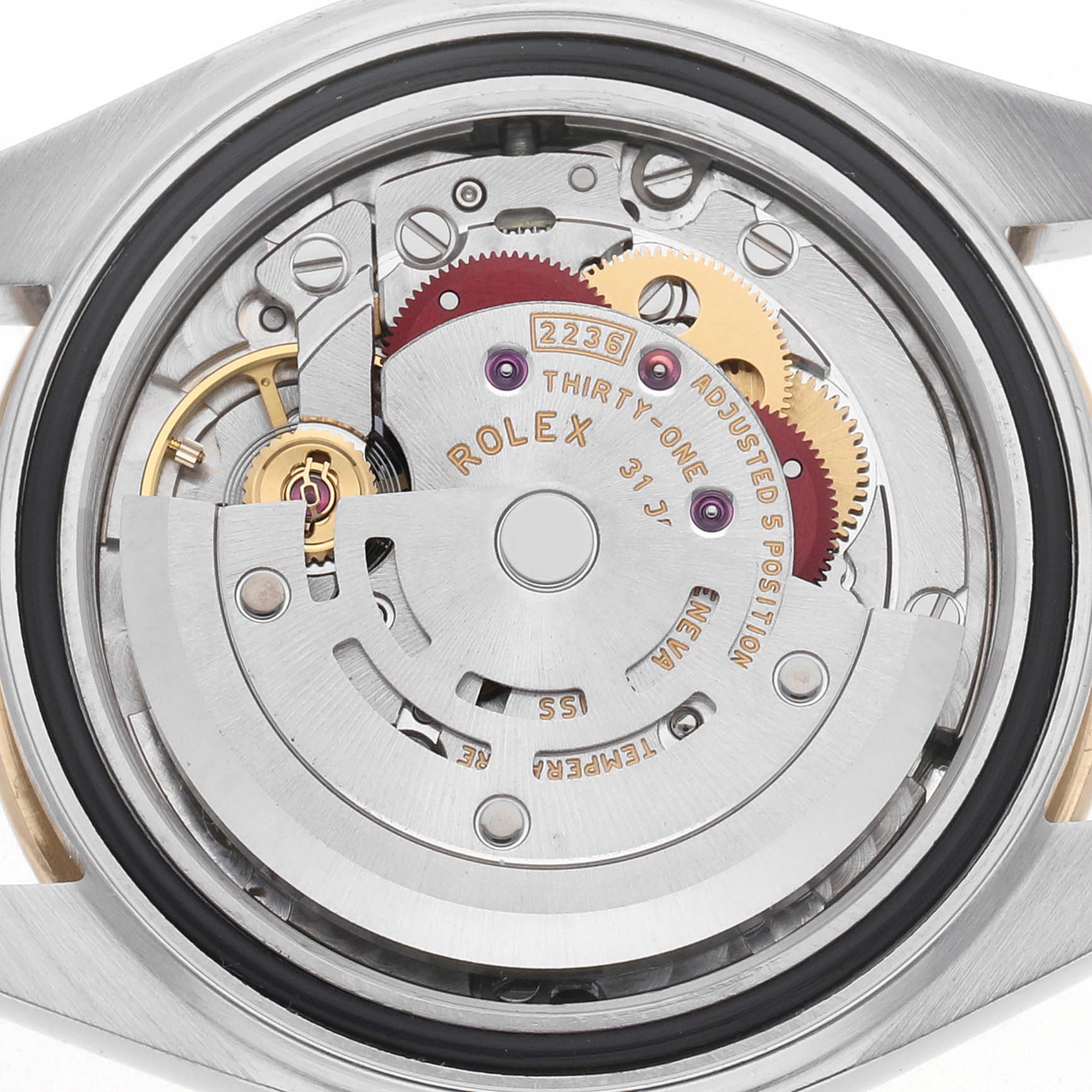 The image shows the movement of a Rolex Datejust 279163 Women's Steel and Gold (two tone) Silver Dial 279163 Women's Steel and Gold (two tone) Silver Dial watch from a rear angle, highlighting gears and mechanical components.