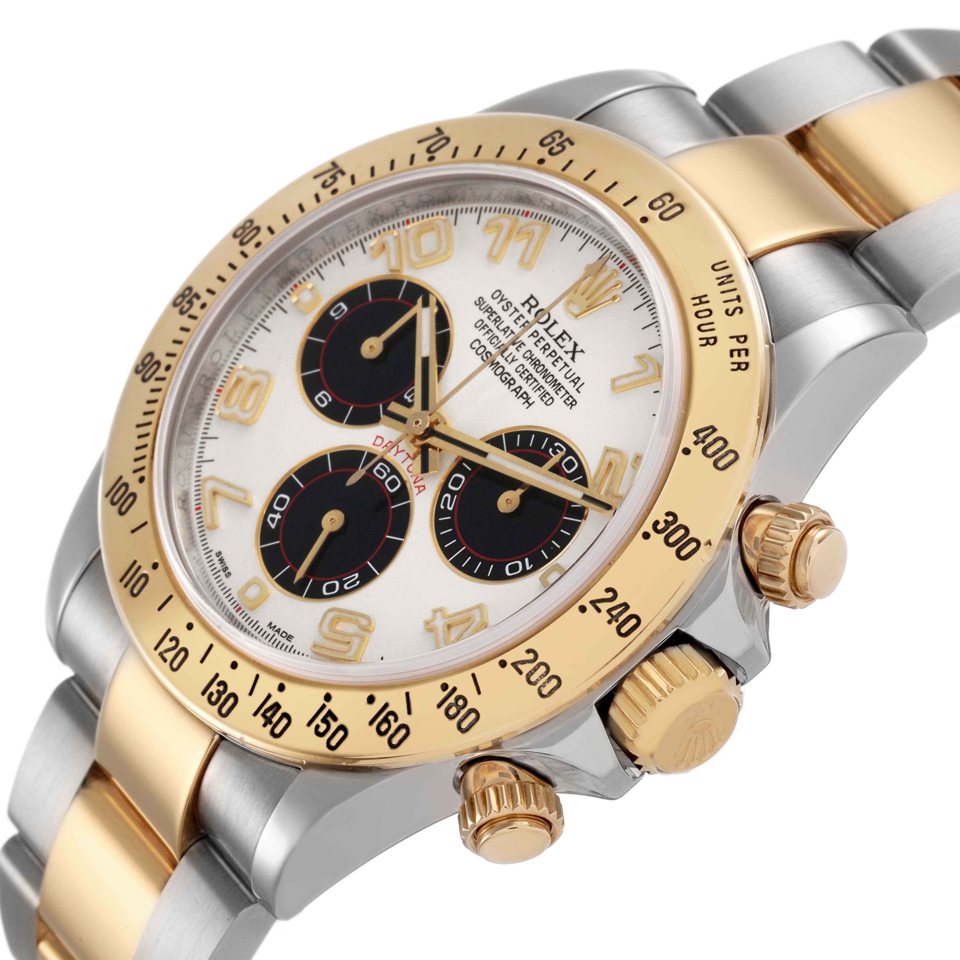 The Rolex Daytona 116523 Men's Steel and Gold (two tone) Silver Dial watch is shown at an angle highlighting the face, bezel, crown, and part of the bracelet.