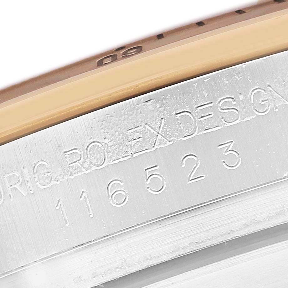 The image shows a close-up of the engraved side of a Rolex Daytona 116523 Men's Steel and Gold (two tone) Silver Dial watch case, displaying part of the reference number.