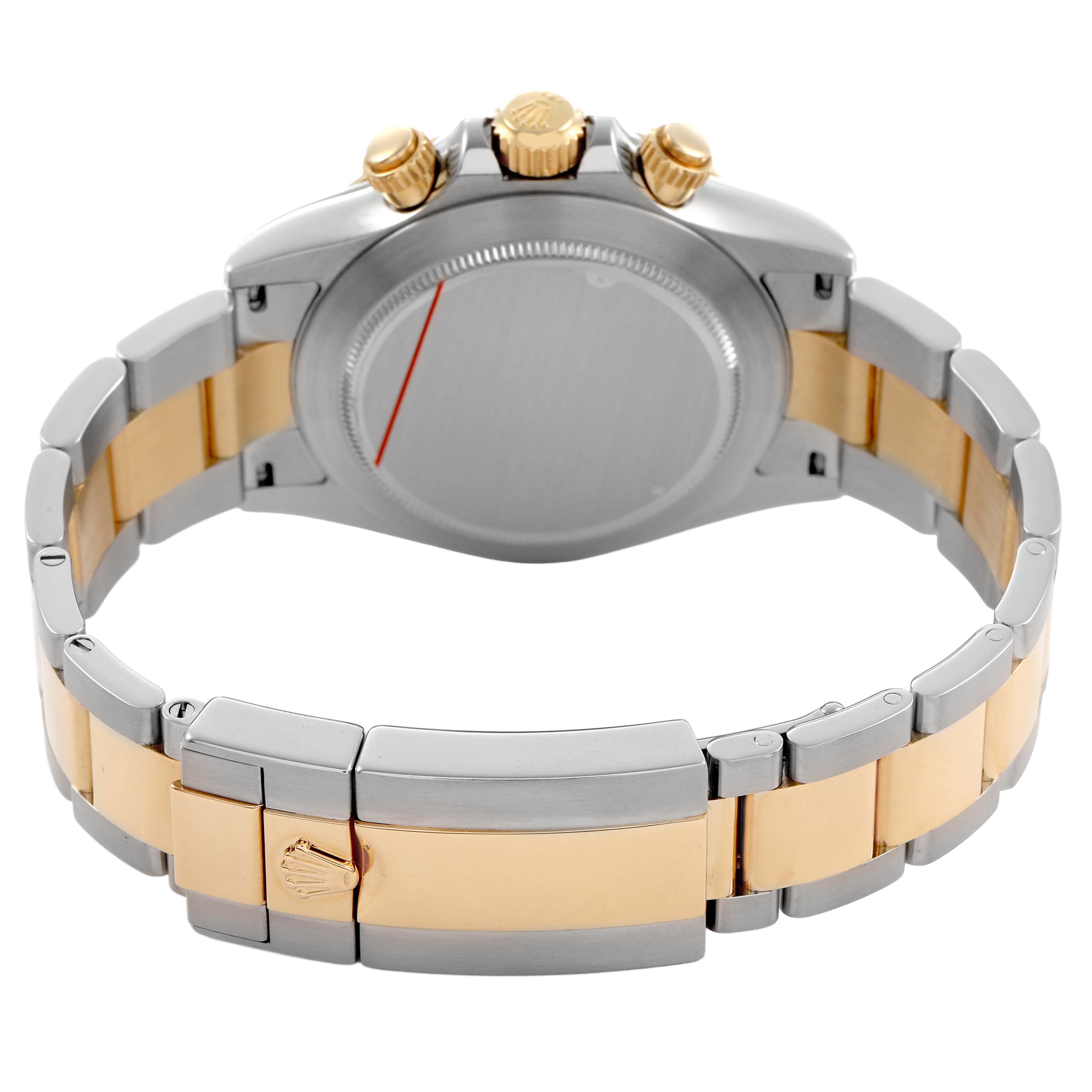 The Rolex Daytona 116523 Men's Steel and Gold (two tone) Silver Dial watch is shown from the back, highlighting the case back and two-tone bracelet clasp.