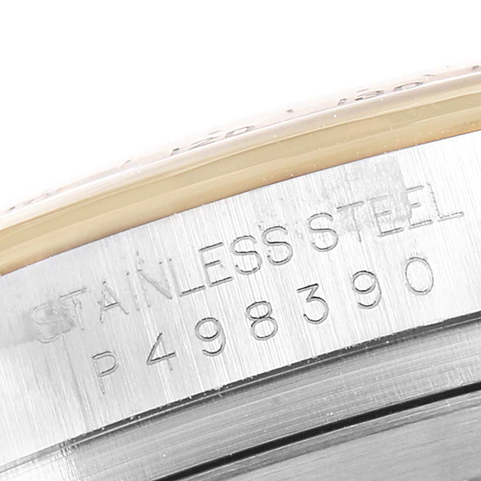 The image shows a close-up of the serial number and "STAINLESS STEEL" engraving on the case side of the Rolex Daytona 116523 Men
s Steel and Gold (two tone) White Dial 116523 Men
s Steel and Gold (two tone) White Dial watch.