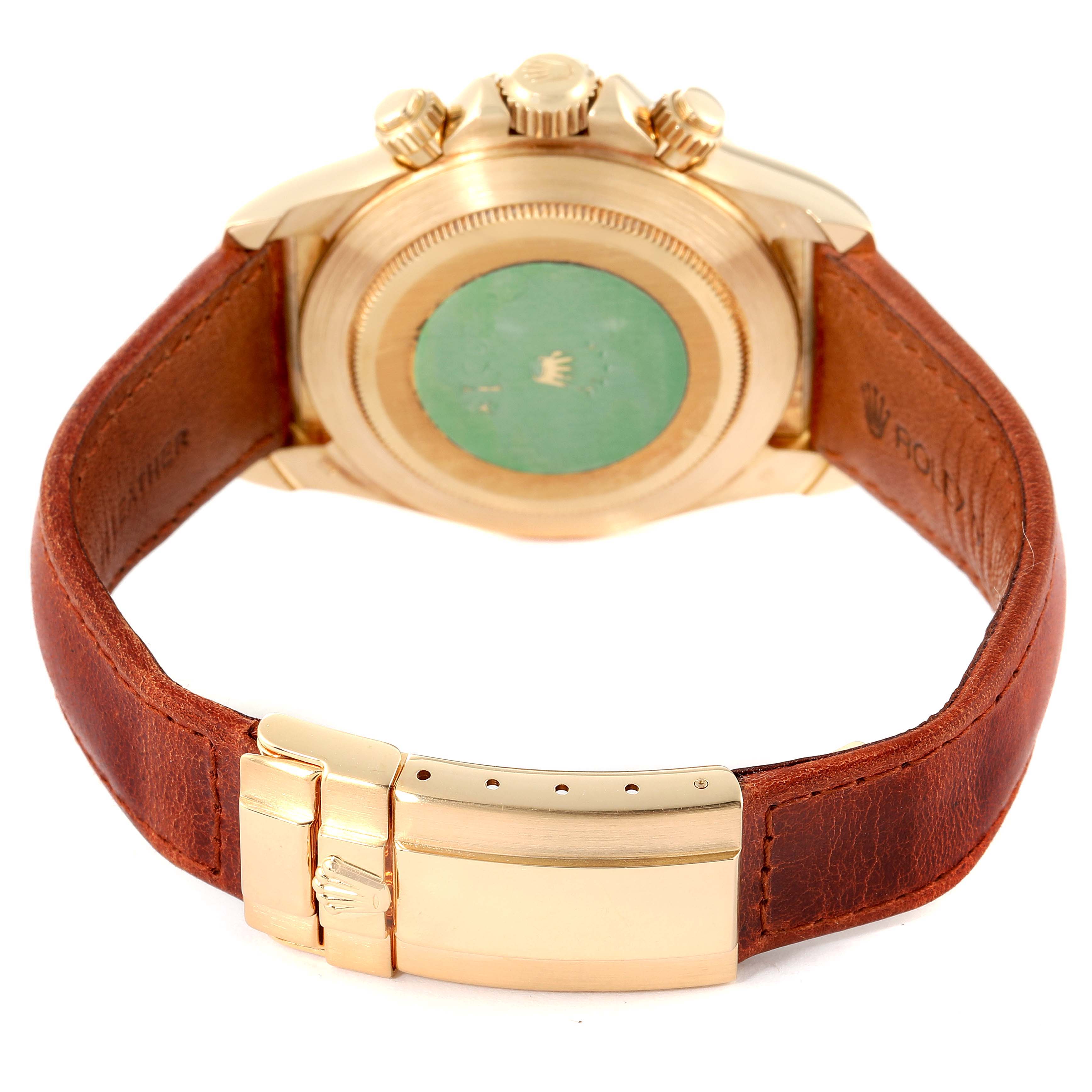 This image shows the back view of a Rolex Daytona 16518 Men's Yellow Gold White Dial 16518 Men's Yellow Gold White Dial watch featuring the case back, crown, and brown leather strap with clasp.
