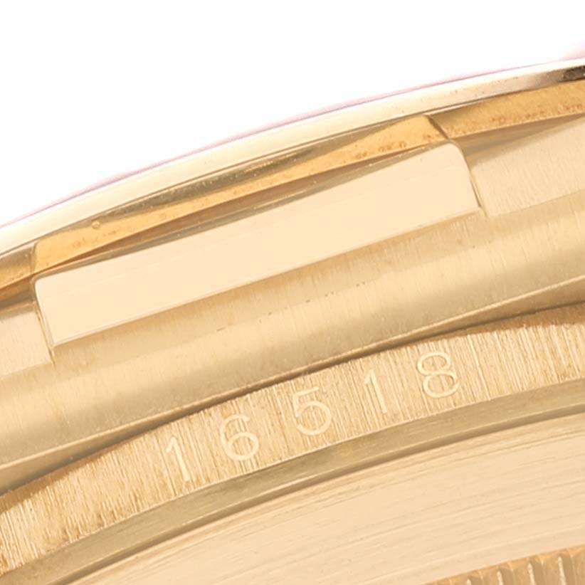 The image shows a close-up of the case side and part of the bezel of a Rolex Daytona 16518 Men's Yellow Gold White Dial 16518 Men's Yellow Gold White Dial watch, displaying the engraving "16518."
