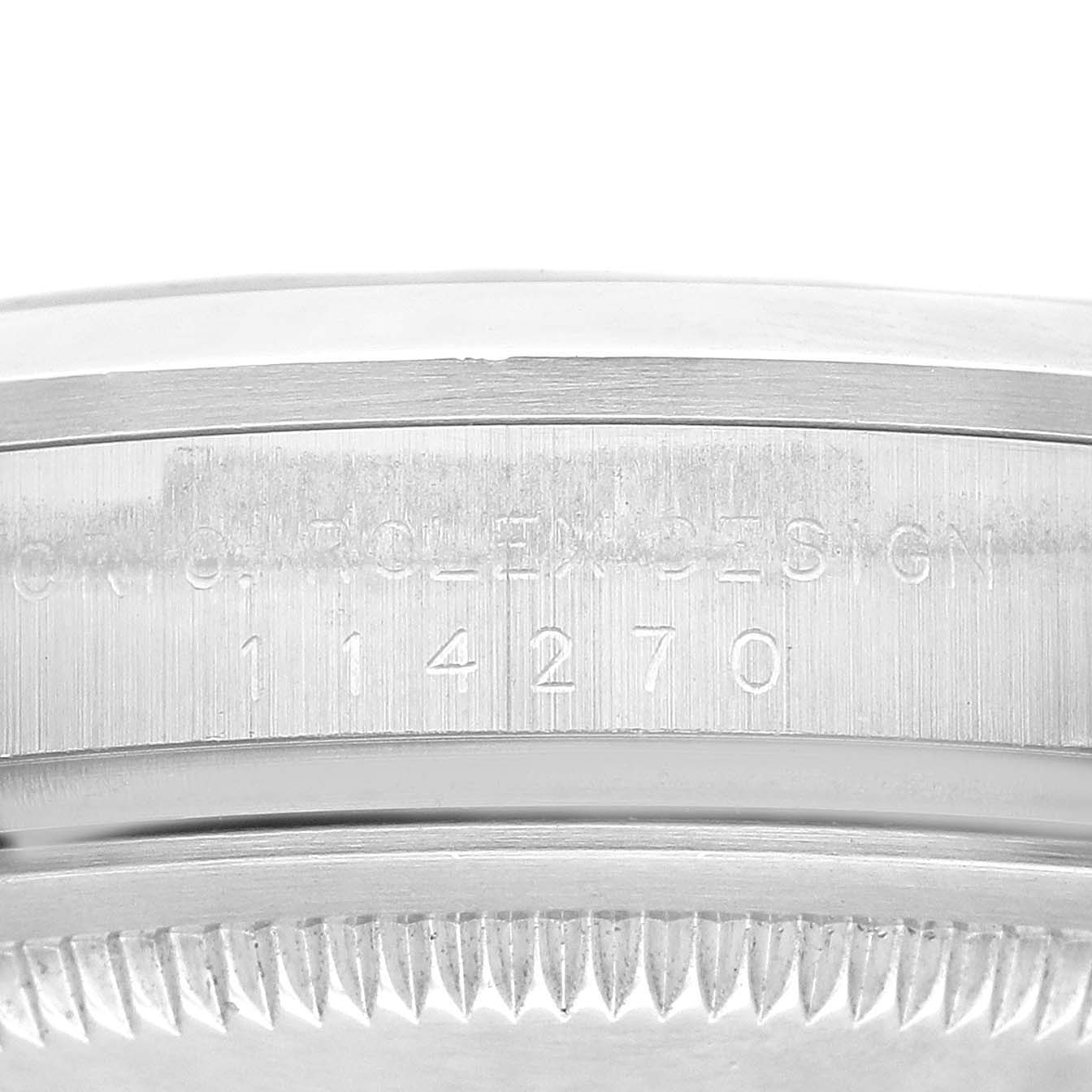 This image shows a close-up of the side of a Rolex Explorer 114270 Men
s Stainless Steel Black Dial 114270 Men
s Stainless Steel Black Dial watch, focusing on the engraved model number and textured edge details.
