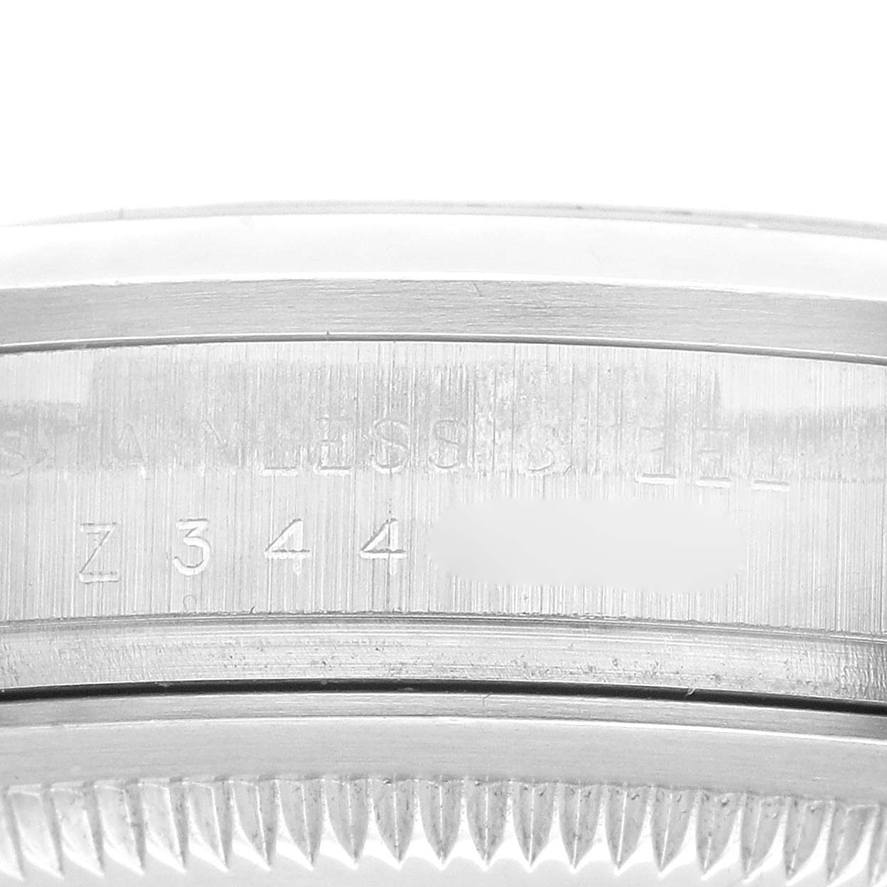 This image shows the side angle of the stainless steel case with some engraved markings of the Rolex Explorer 114270 Men
s Stainless Steel Black Dial 114270 Men
s Stainless Steel Black Dial watch.