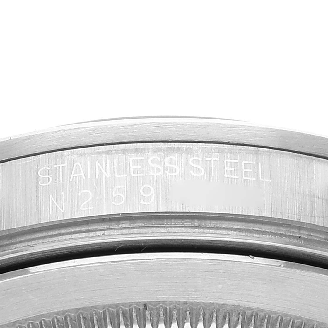 The image shows a close-up of the stainless steel bezel and casing inscription of a Rolex Explorer 16570 Men's Stainless Steel Black Dial 16570 Men's Stainless Steel Black Dial watch.