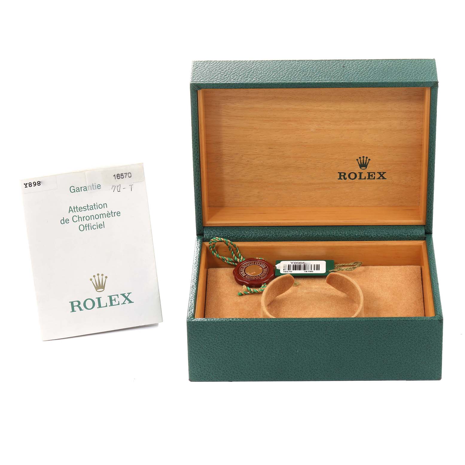 The image shows an open Rolex Explorer 16570 Men
s Stainless Steel Black Dial 16570 Men
s Stainless Steel Black Dial box with official documents and tags, displaying the packaging and accessories from a high-angle view.