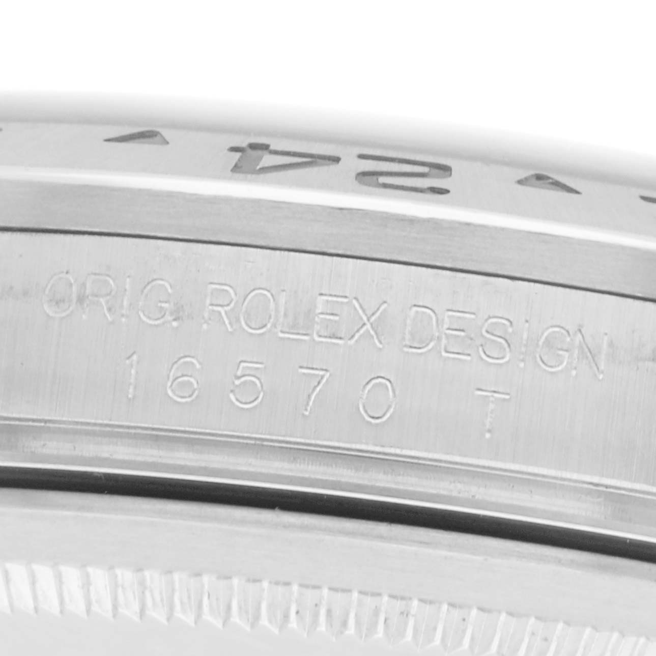 The image shows a close-up of the Rolex Explorer 16570 Men
s Stainless Steel Black Dial 16570 Men
s Stainless Steel Black Dial model 16570, focusing on the engraved case side.