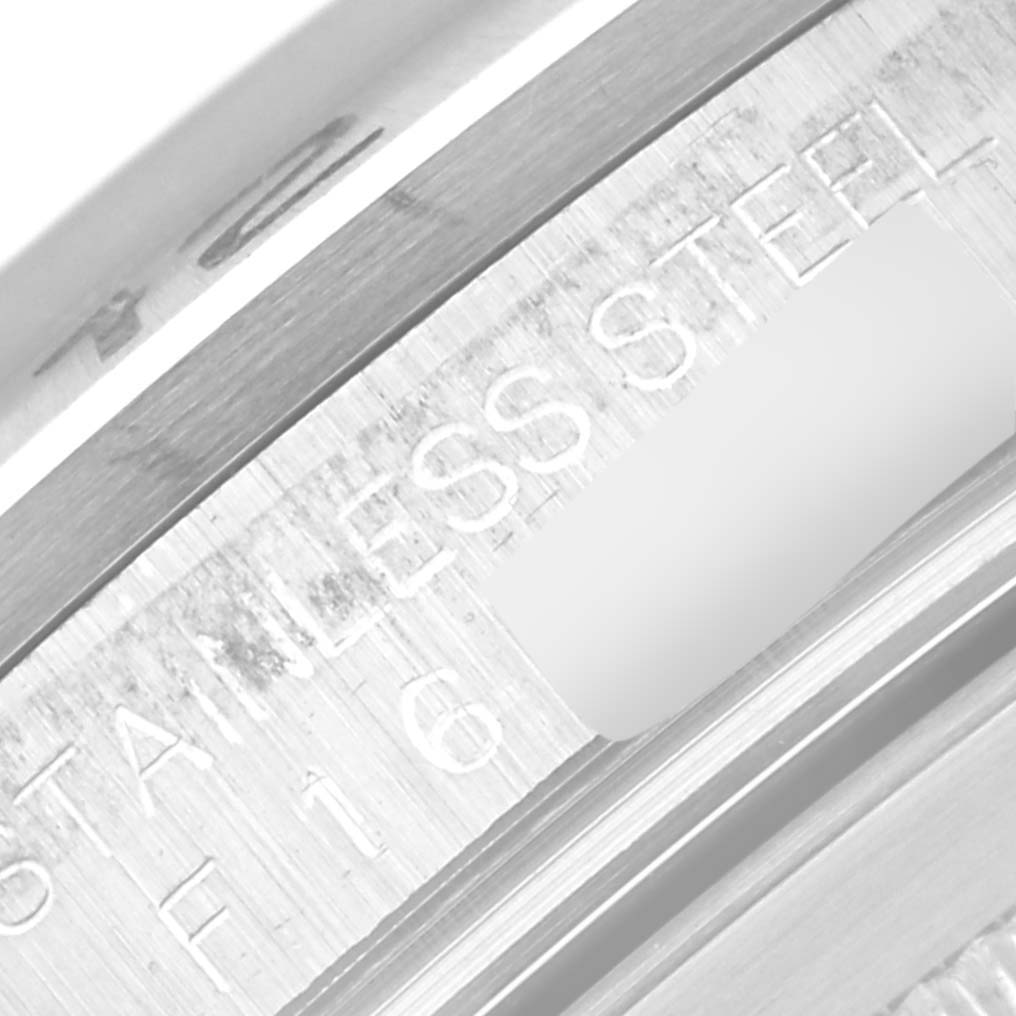 This close-up image shows the stainless steel engraving on the inner bezel of the Rolex Explorer 16570 Men
s Stainless Steel Black Dial 16570 Men
s Stainless Steel Black Dial watch.