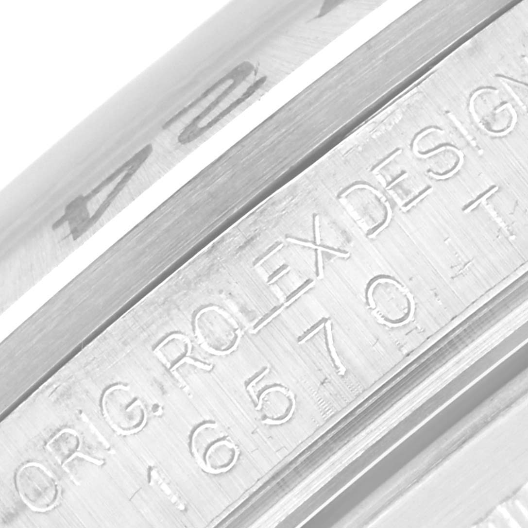 The image shows a close-up view of the engraved reference number and design details on a Rolex Explorer 16570 Men
s Stainless Steel Black Dial 16570 Men
s Stainless Steel Black Dial model watch case.