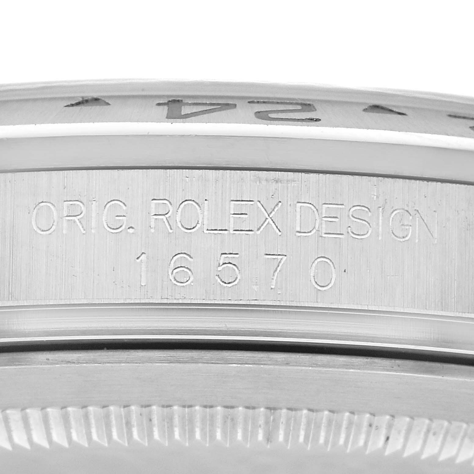 This image shows the side of a Rolex Explorer 16570 Men's Stainless Steel White Dial 16570 Men's Stainless Steel White Dial watch, highlighting its engraved model number "16570" and "ORIG. ROLEX DESIGN" text.