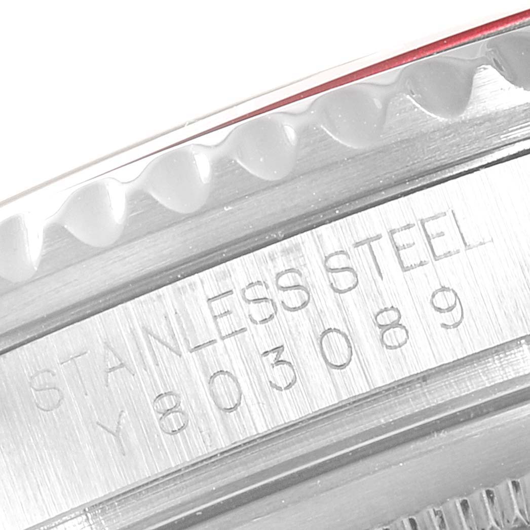 This image shows a close-up of the stainless steel case and serial number of a Rolex GMT-Master 16710 Men's Stainless Steel Black Dial 16710 Men's Stainless Steel Black Dial watch.