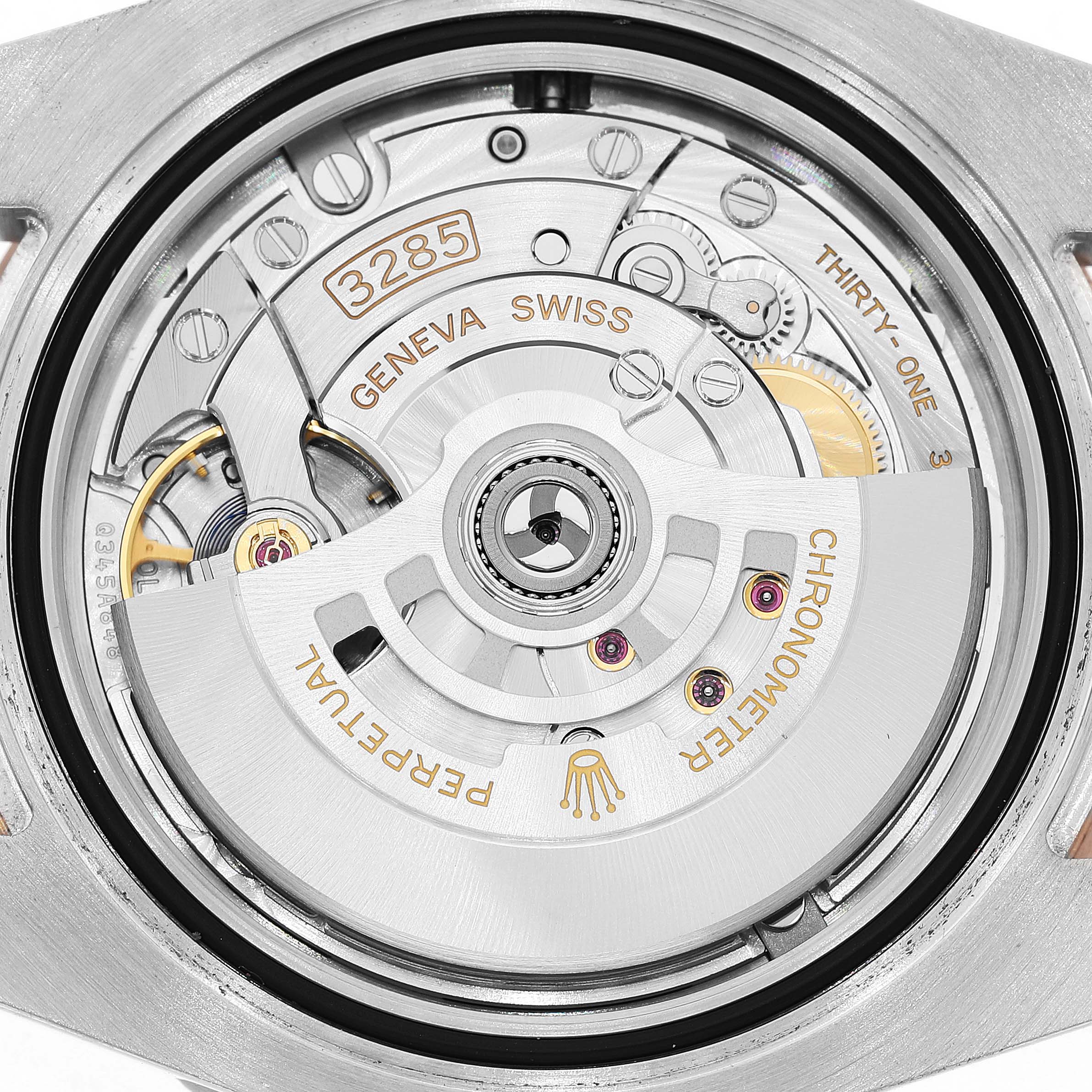 The image shows the back view of the Rolex GMT-Master 126711CHNR Men's Steel and Gold (two tone) Black Dial's movement, highlighting the intricate gears and rotor.