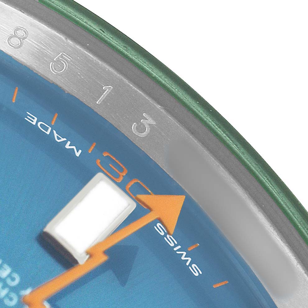 The image shows a close-up of the Rolex Milgauss M116400GV Men's Stainless Steel Blue Dial watch face, highlighting the edge, minute markers, and part of the seconds hand.