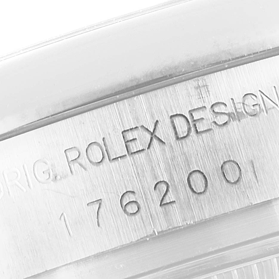 This close-up image shows the engraved serial number and design details on the side of a Rolex Oyster Perpetual 176200 Women
s Stainless Steel Pink Dial 176200 Women
s Stainless Steel Pink Dial watch.