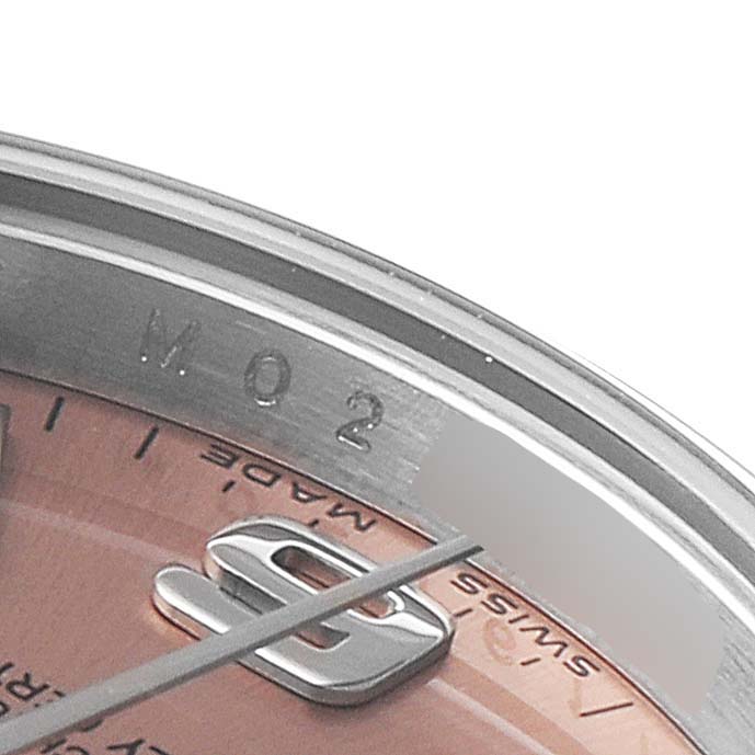 This close-up angle shows the dial and part of the chapter ring of a Rolex Oyster Perpetual 176200 Women
s Stainless Steel Pink Dial 176200 Women
s Stainless Steel Pink Dial watch.