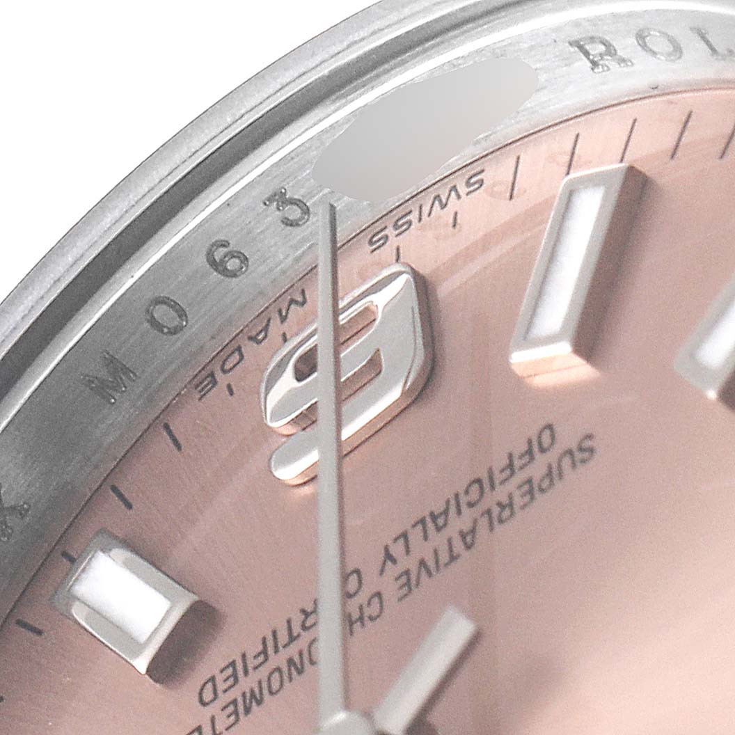 This close-up angle shows the dial and part of the bezel of the Rolex Oyster Perpetual 176200 Women's Stainless Steel Pink Dial 176200 Women's Stainless Steel Pink Dial watch, highlighting the 9 o'clock marker.