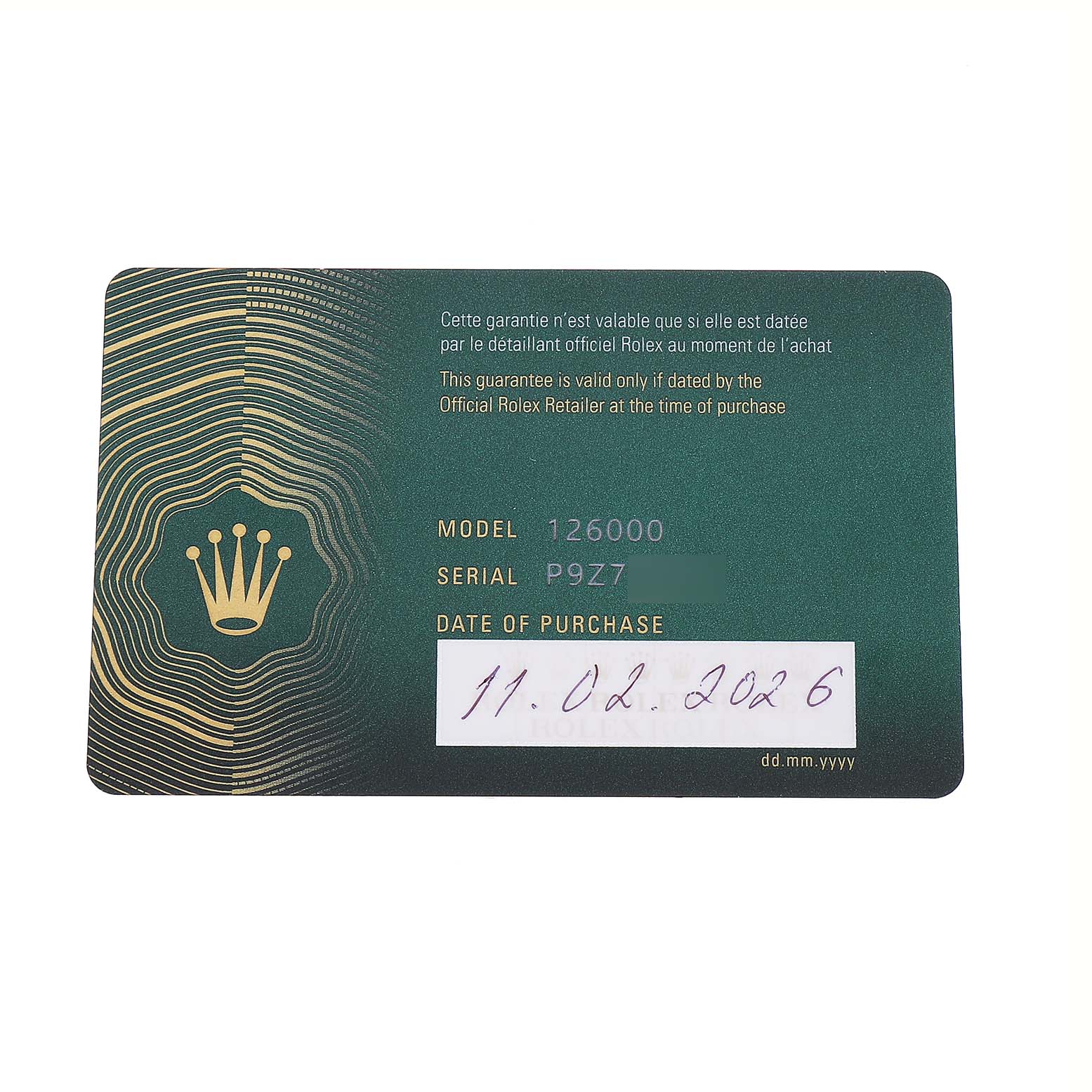 The image shows a warranty card for the Rolex Oyster Perpetual M126000-0001 Men's Stainless Steel Beige Dial model 126000 from a top view.