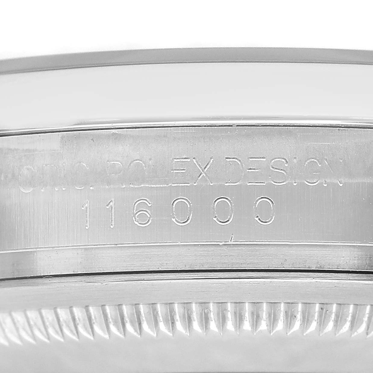 The image shows the case side of a Rolex Oyster Perpetual 116000 Men's Stainless Steel Silver Dial, highlighting its engraved serial number.