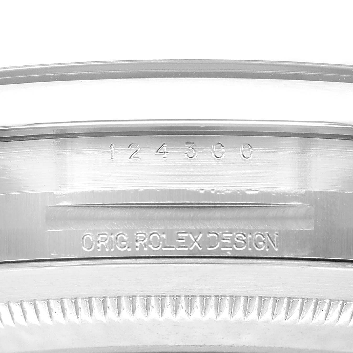 The image shows the engraved model number and "ORIG. ROLEX DESIGN" on the side of a Rolex Oyster Perpetual M124300-0002 Men's Stainless Steel Black Dial watch case.