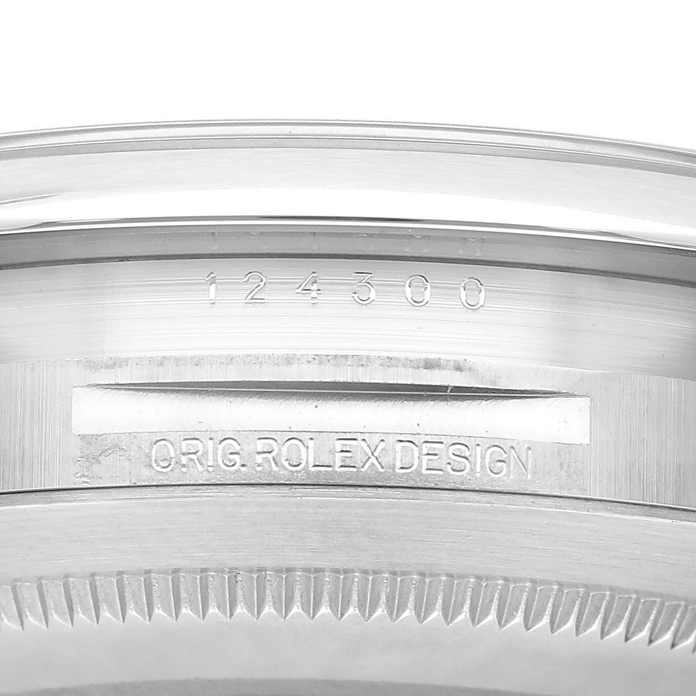 The image shows a close-up of the case side, featuring "ORIG. ROLEX DESIGN" and model number for the Rolex Oyster Perpetual M124300-0005 Men's Stainless Steel Green Dial.