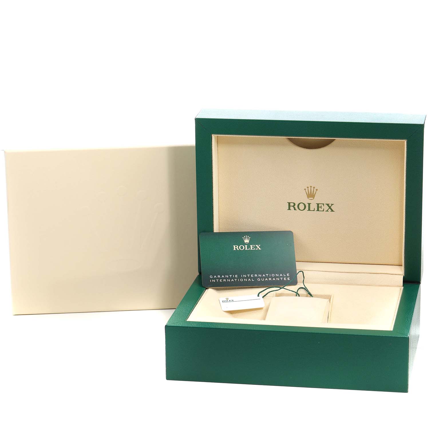 The image shows the Rolex Oyster Perpetual M124300-0005 Men's Stainless Steel Green Dial watch box with the warranty card and tag inside.