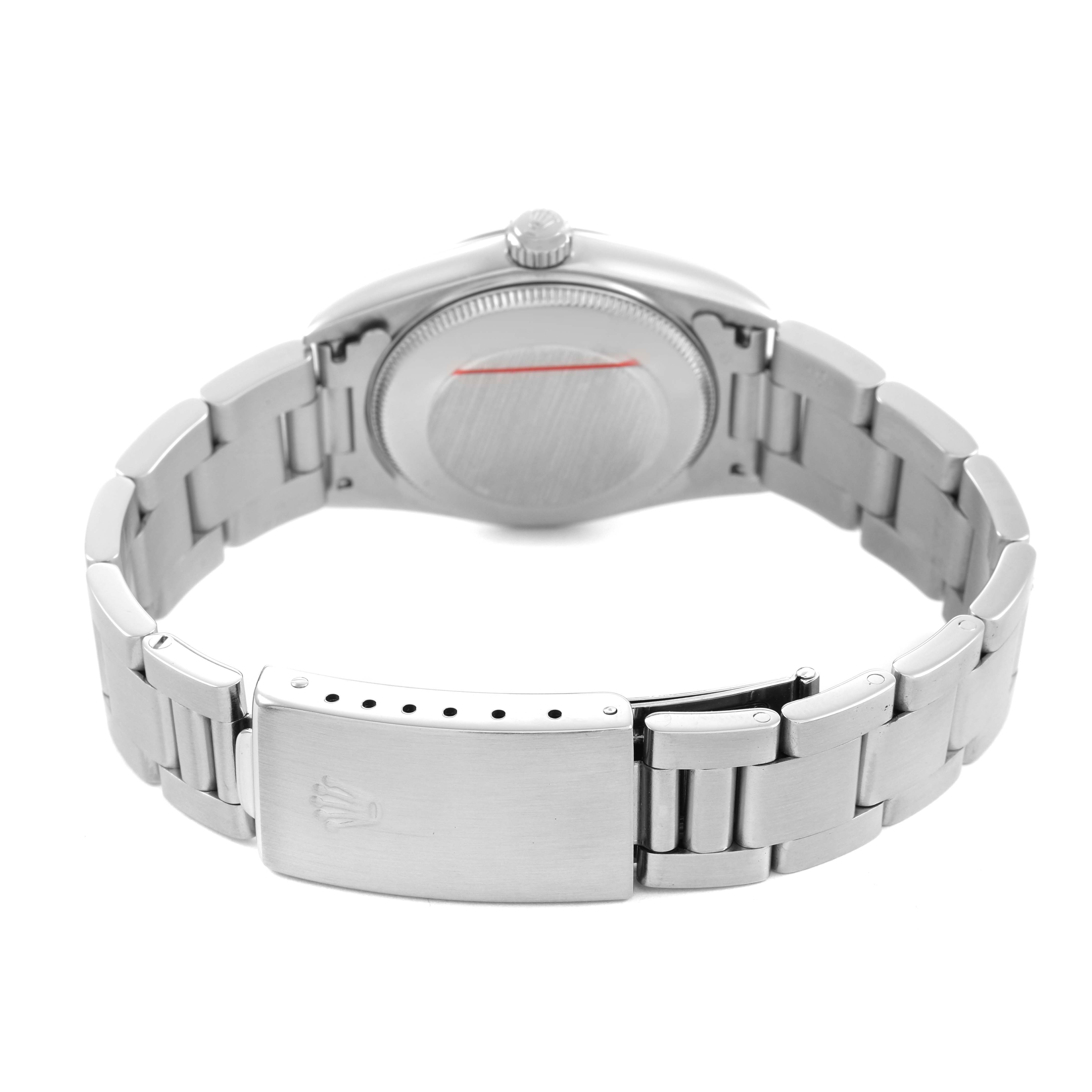 The image shows the back view of a Rolex Oyster Perpetual 77080 Women's Stainless Steel Black Dial, highlighting the case back, bracelet, and clasp.