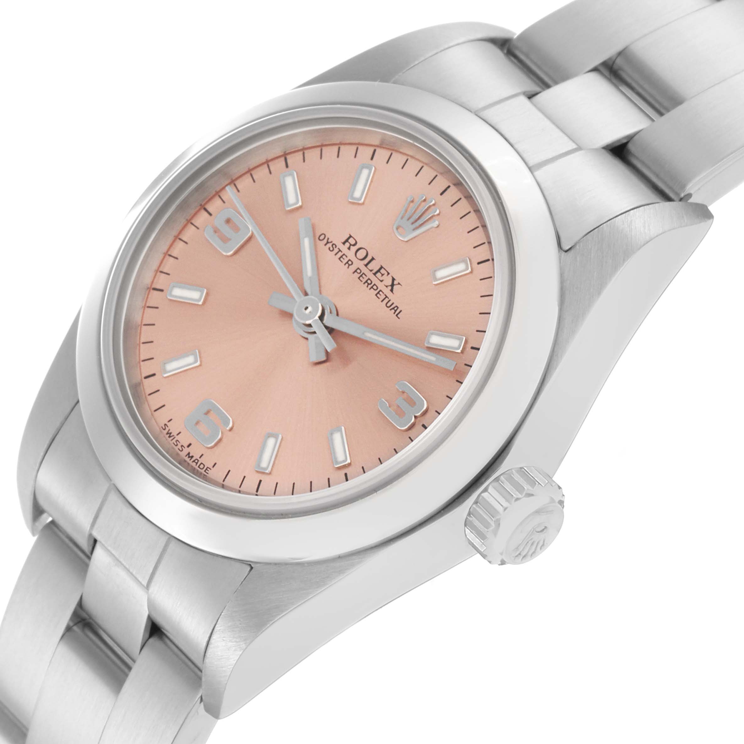 The Rolex Oyster Perpetual 72105 Women's Stainless Steel Pink Dial 72105 Women's Stainless Steel Pink Dial watch is shown from a slightly angled, close-up view featuring its peach dial, crown, and stainless steel bracelet.