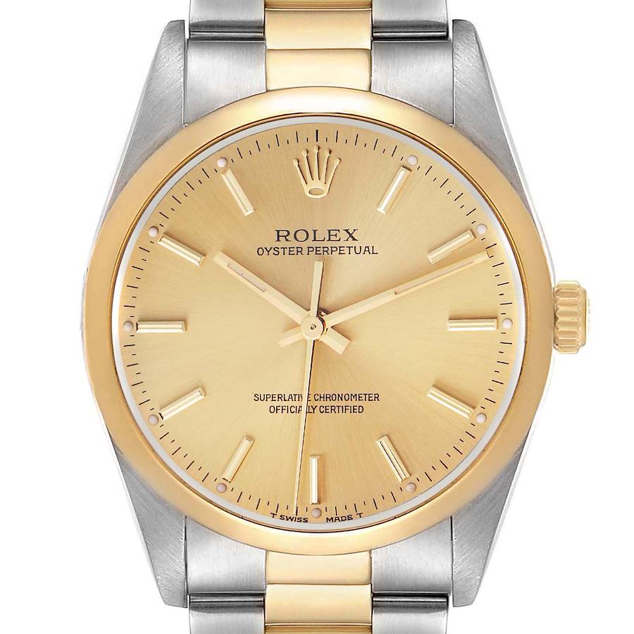 The Rolex Oyster Perpetual watch is shown from the front, highlighting the gold dial and steel-gold bracelet.