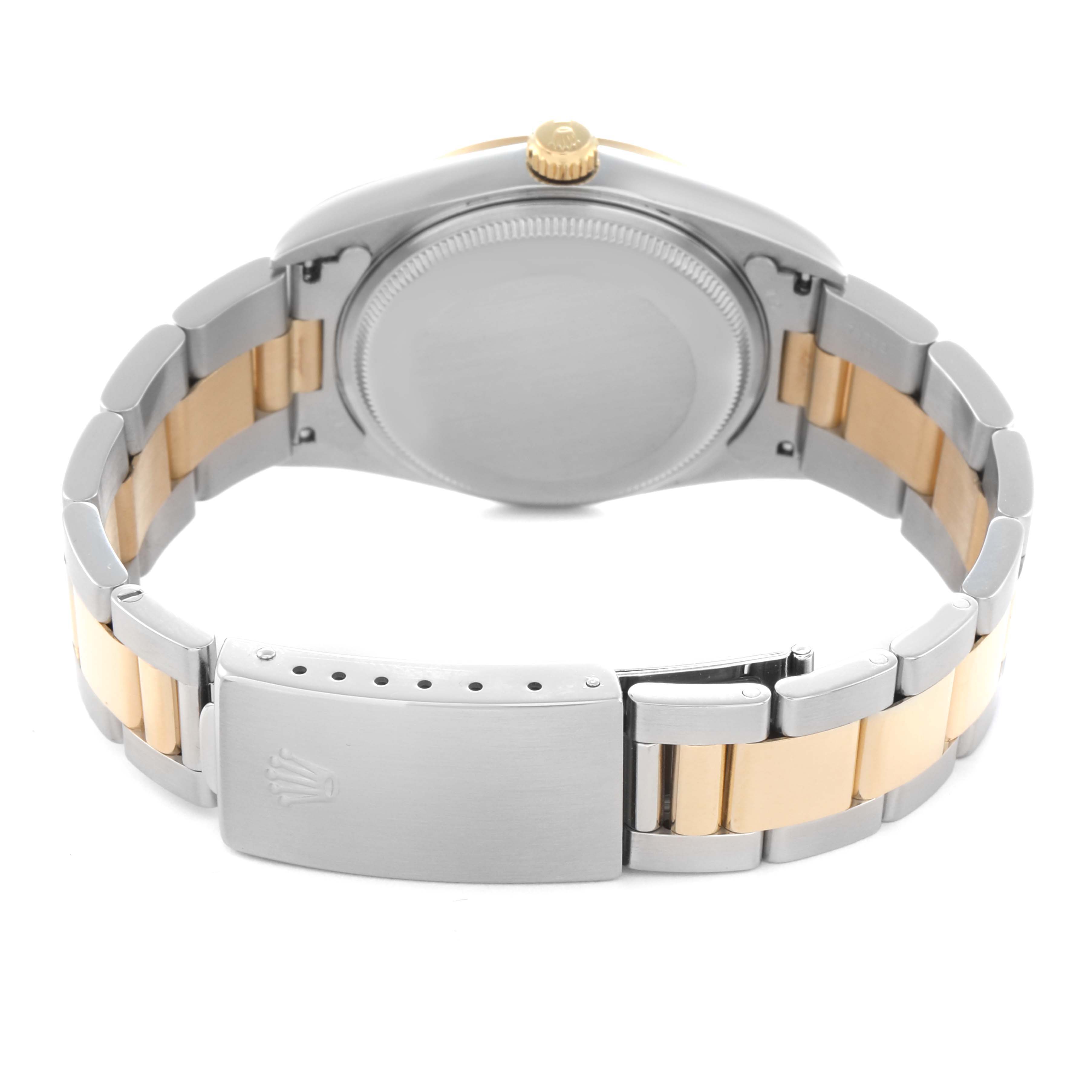 The Rolex Oyster Perpetual 14203 Men
s Steel and Gold (two tone) Champagne Dial 14203 Men
s Steel and Gold (two tone) Champagne Dial watch is shown from the back, featuring the bracelet
s clasp and case back.