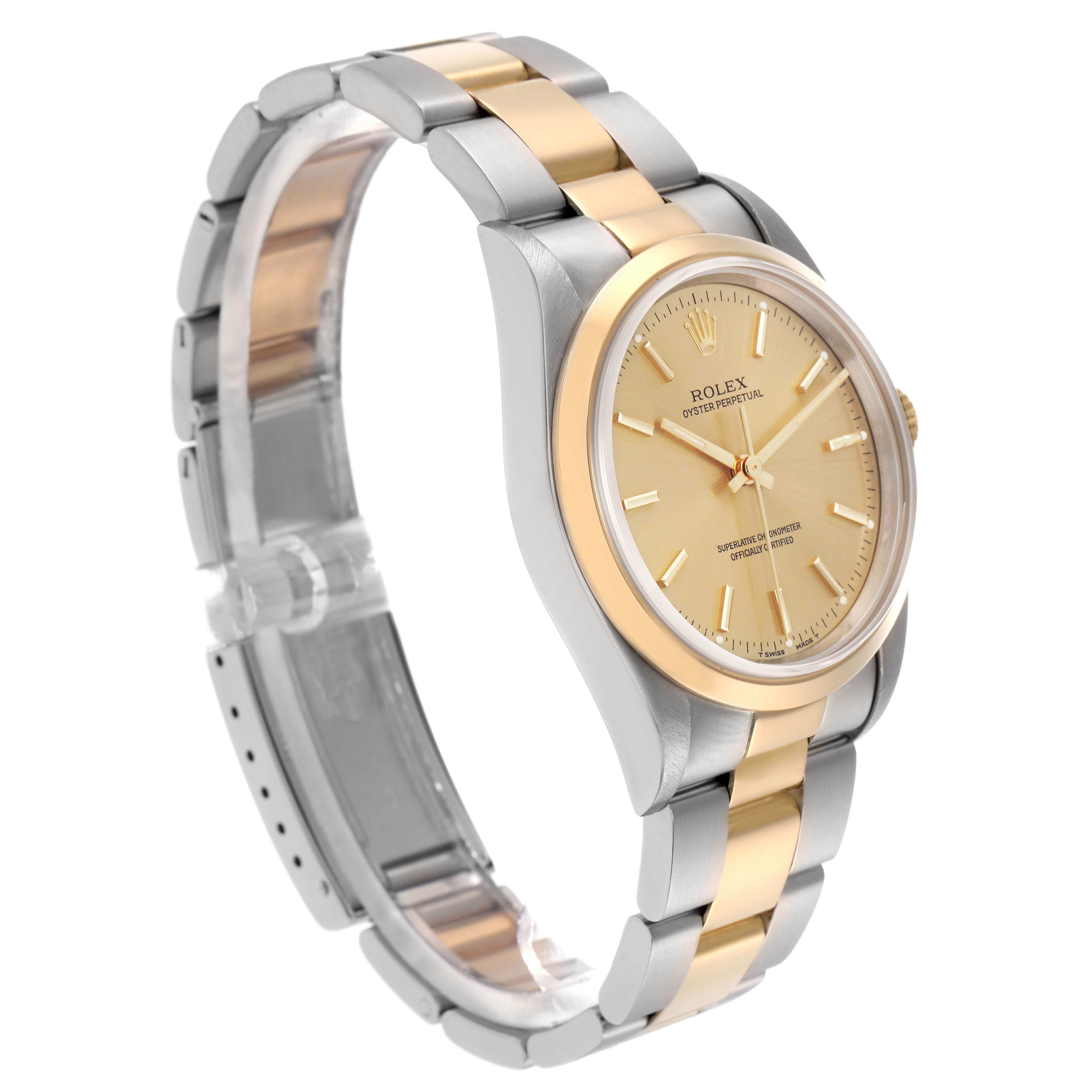 The Rolex Oyster Perpetual 14203 Men
s Steel and Gold (two tone) Champagne Dial 14203 Men
s Steel and Gold (two tone) Champagne Dial is shown at a three-quarter angle, highlighting its gold and silver bracelet and gold dial.
