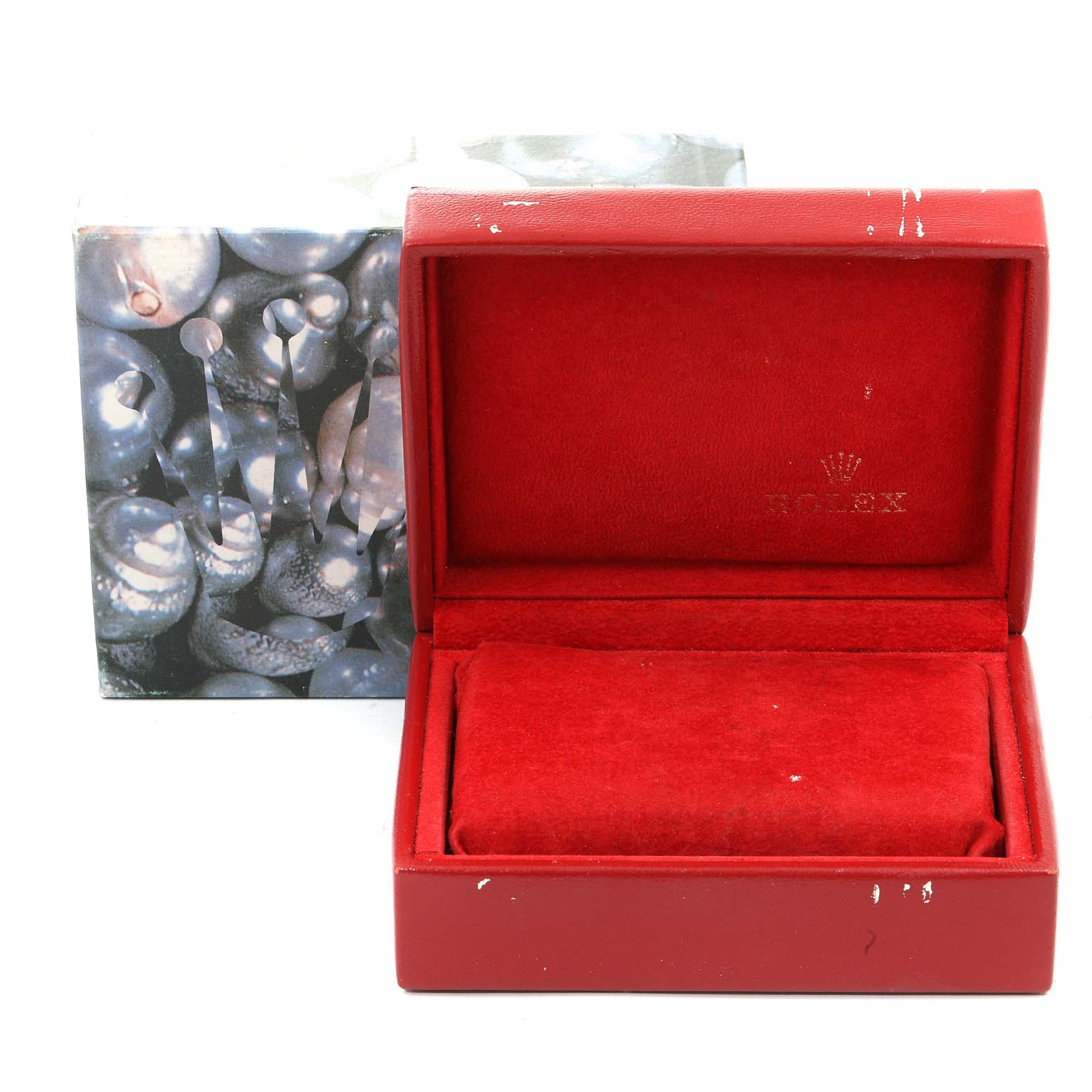 This image shows an open red box with a padded interior for a Rolex President 69178 Women's Yellow Gold Silver Dial 69178 Women's Yellow Gold Silver Dial model watch, along with its decorative outer box.