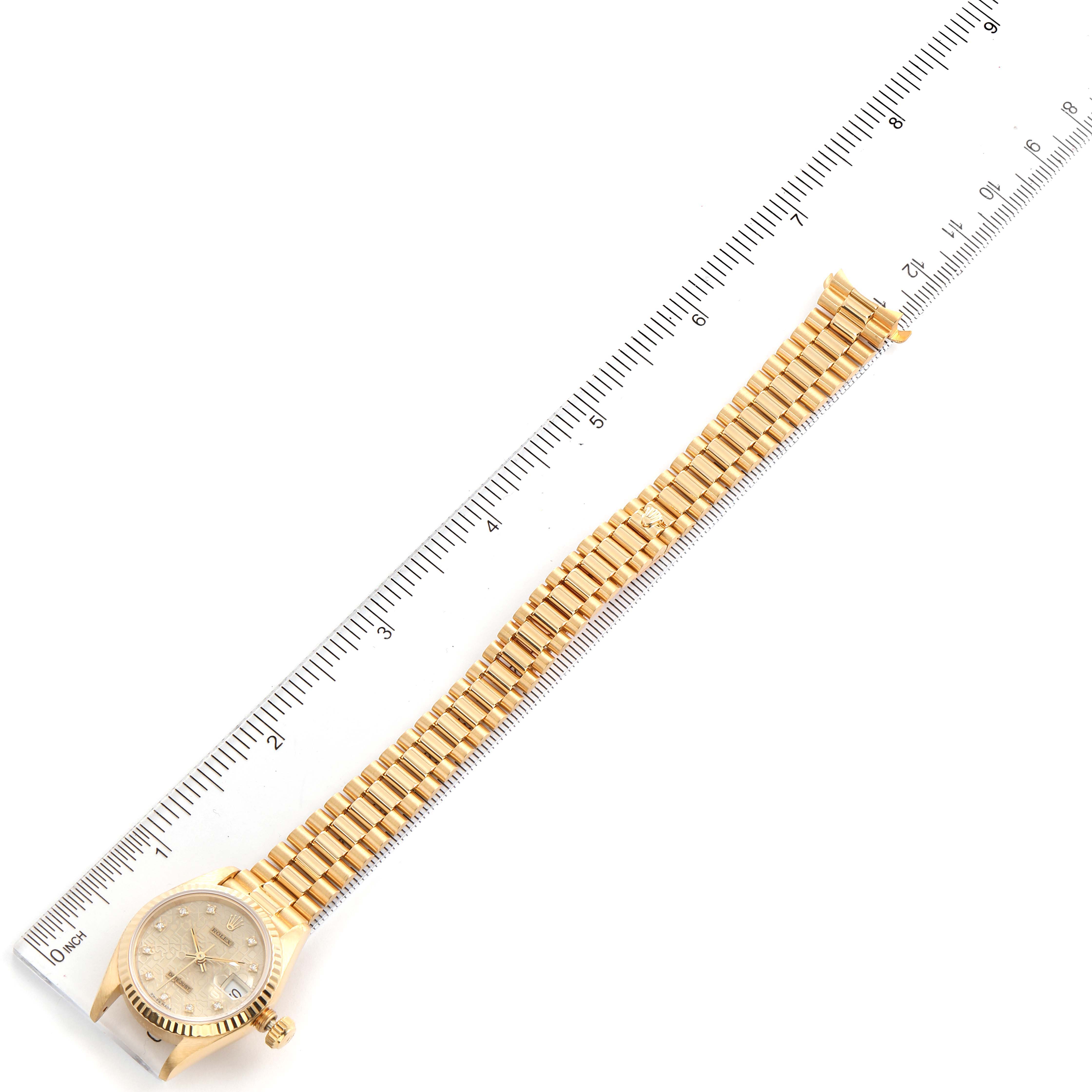 The image shows a Rolex President 69178 Women's Yellow Gold Silver Dial 69178 Women's Yellow Gold Silver Dial model watch in a top-down view, laid next to a ruler for scale.