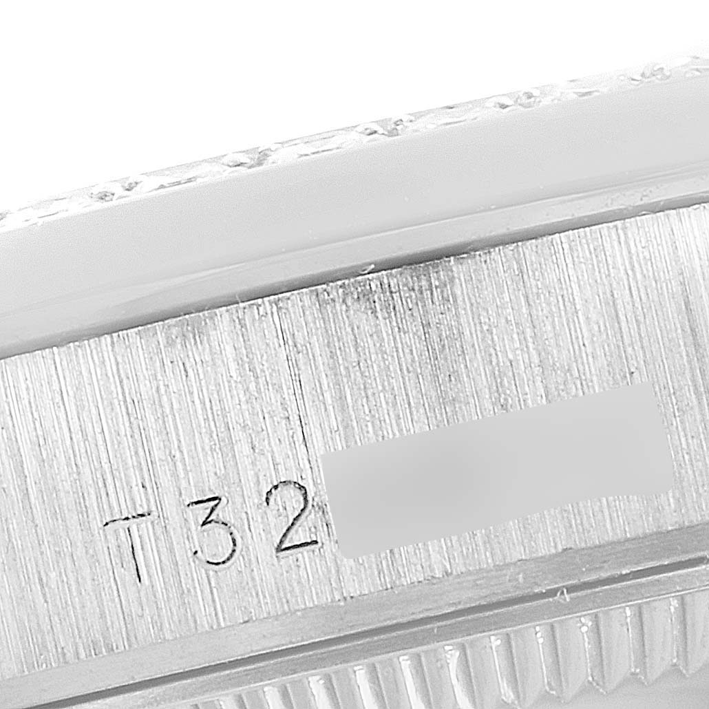 The image shows a close-up of the side casing and part of the bezel of a Rolex President 68286 Women
s Platinum Silver Dial 68286 Women
s Platinum Silver Dial model watch.