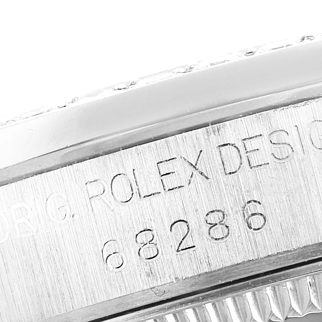 Close-up of the serial number engraving on the case edge of a Rolex President 68286 Women
s Platinum Silver Dial 68286 Women
s Platinum Silver Dial model watch.