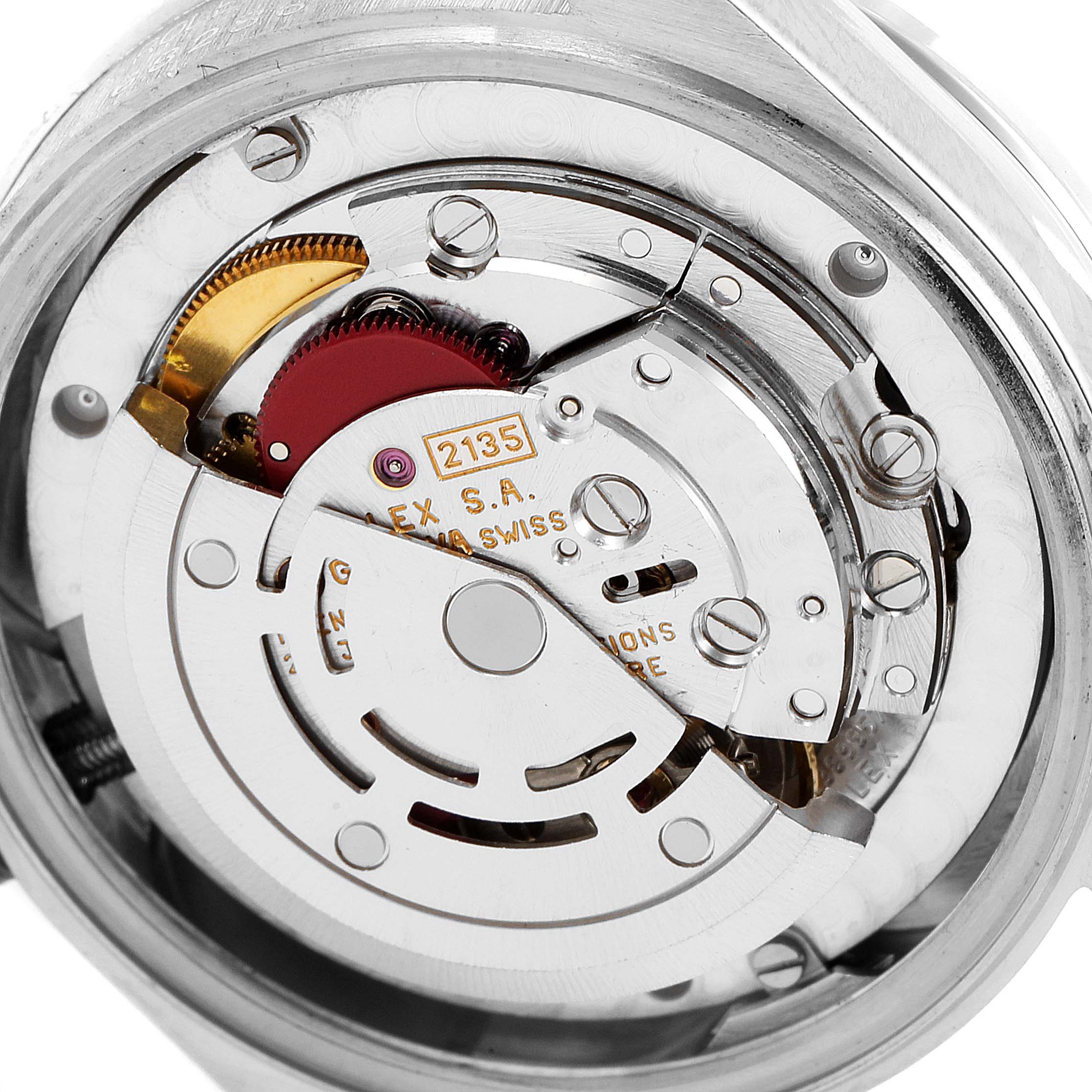 The image shows a close-up of the movement of a Rolex President 68286 Women
s Platinum Silver Dial 68286 Women
s Platinum Silver Dial model watch, highlighting its intricate mechanical components.