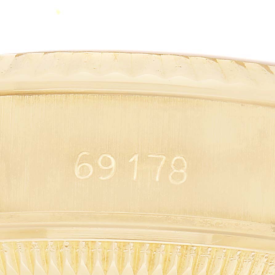 The image shows a close-up of the side profile of a gold Rolex President 69178 Women's Yellow Gold Champagne Dial watch case with the model number 69178 embossed.