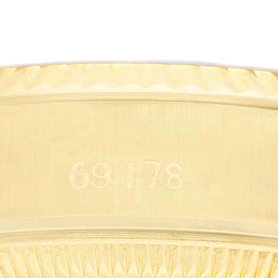 The image shows a close-up of the Rolex President 69178 Men's Yellow Gold Champagne Dial model's bezel and case, highlighting the engraved model number.