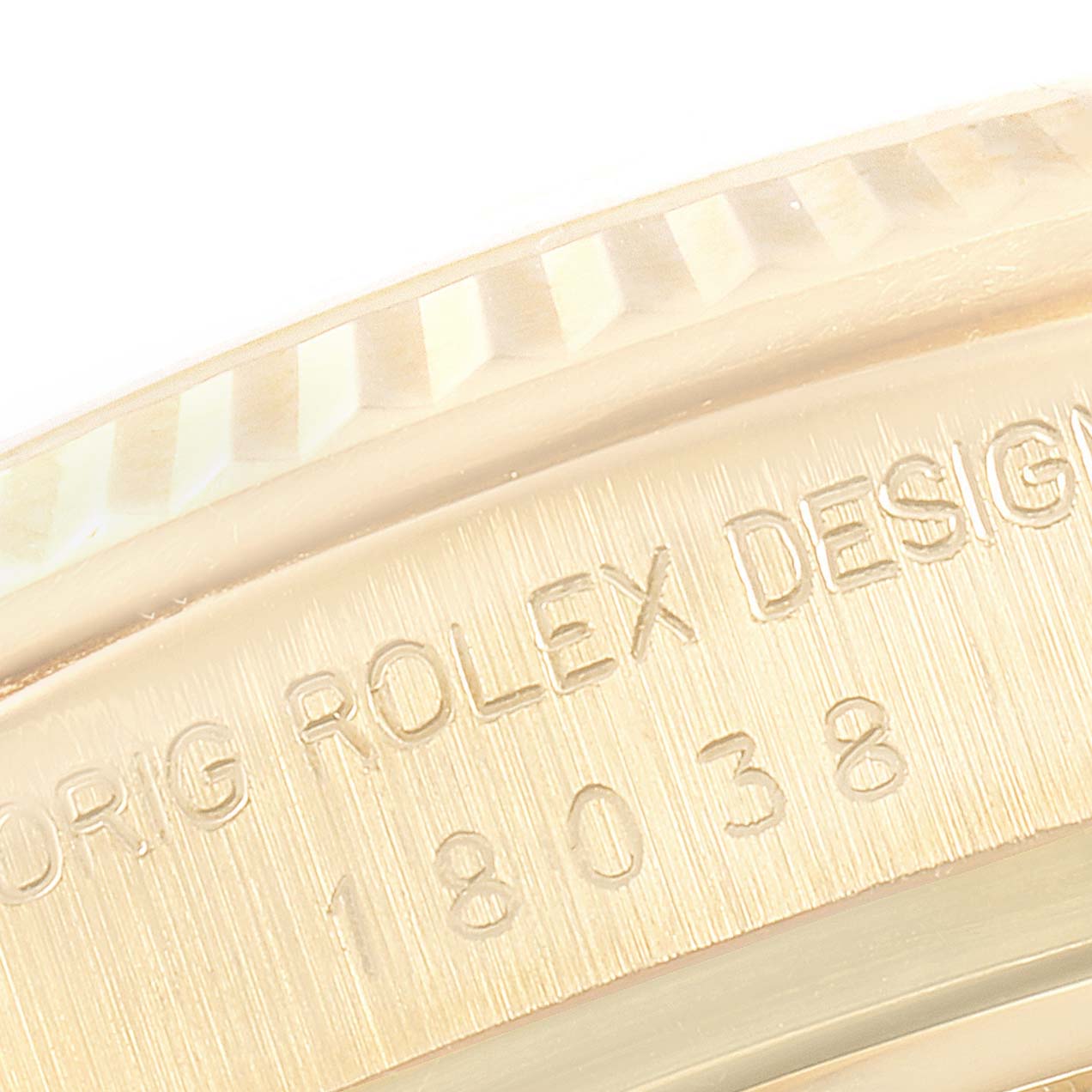 This image shows a close-up of the engraving on the side of the Rolex President 18038 Men
s Yellow Gold Champagne Dial 18038 Men
s Yellow Gold Champagne Dial model watch case.