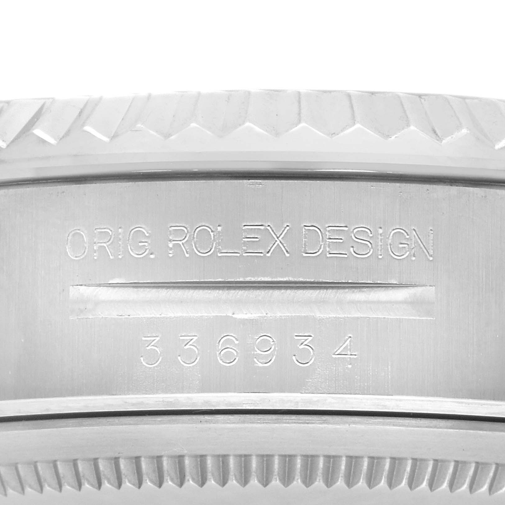 The image shows a close-up of the side of a Rolex Sky-Dweller 336934 Men
s Stainless Steel Green Dial 336934 Men
s Stainless Steel Green Dial, highlighting the engraved design details and model number.