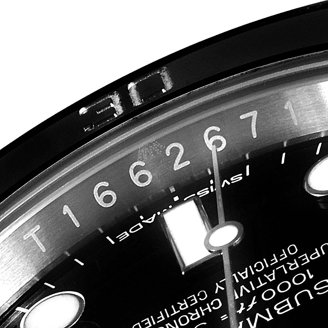 The image shows a close-up of the dial and bezel of a Rolex Submariner 114060 Men
s Stainless Steel Black Dial 114060 Men
s Stainless Steel Black Dial watch, highlighting the minute markers, numerals, and part of the text.