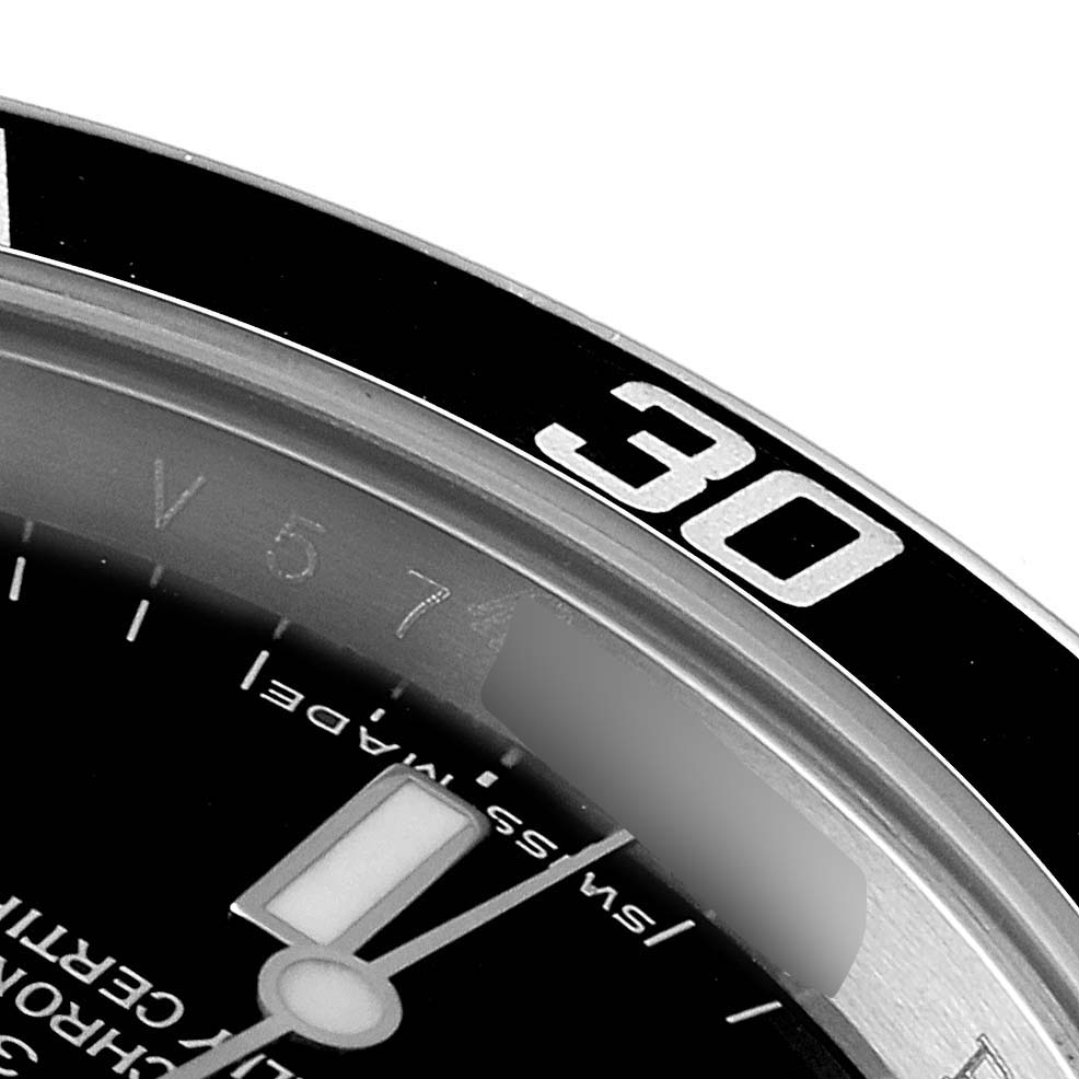 This close-up angle shows the bezel and partial face of the Rolex Submariner 14060 Men
s Stainless Steel Black Dial 14060 Men
s Stainless Steel Black Dial, highlighting the 30-minute mark.