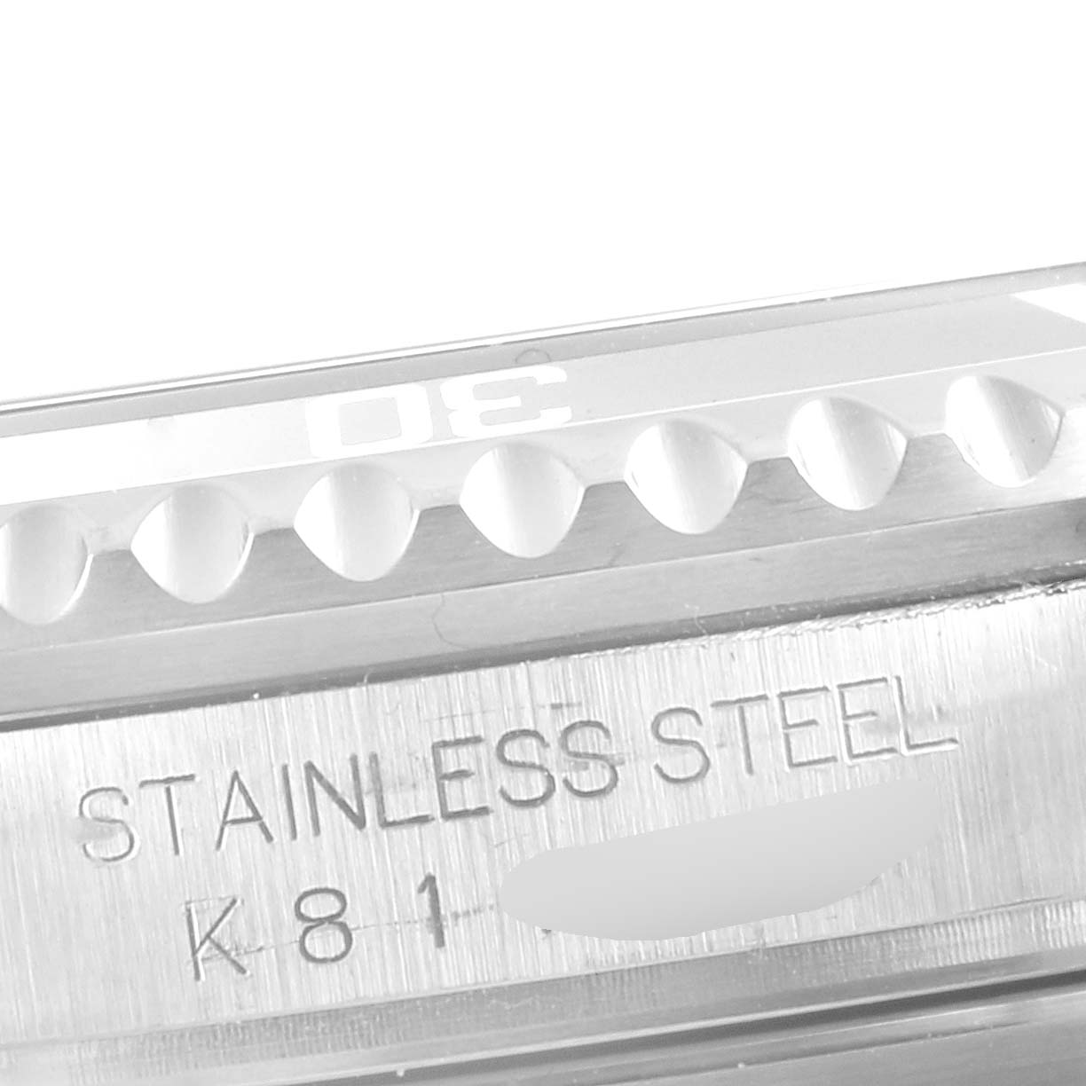 The image shows a close-up of the bezel and stainless steel engraving on a Rolex Submariner 16610 Men
s Stainless Steel Black Dial 16610 Men
s Stainless Steel Black Dial watch.