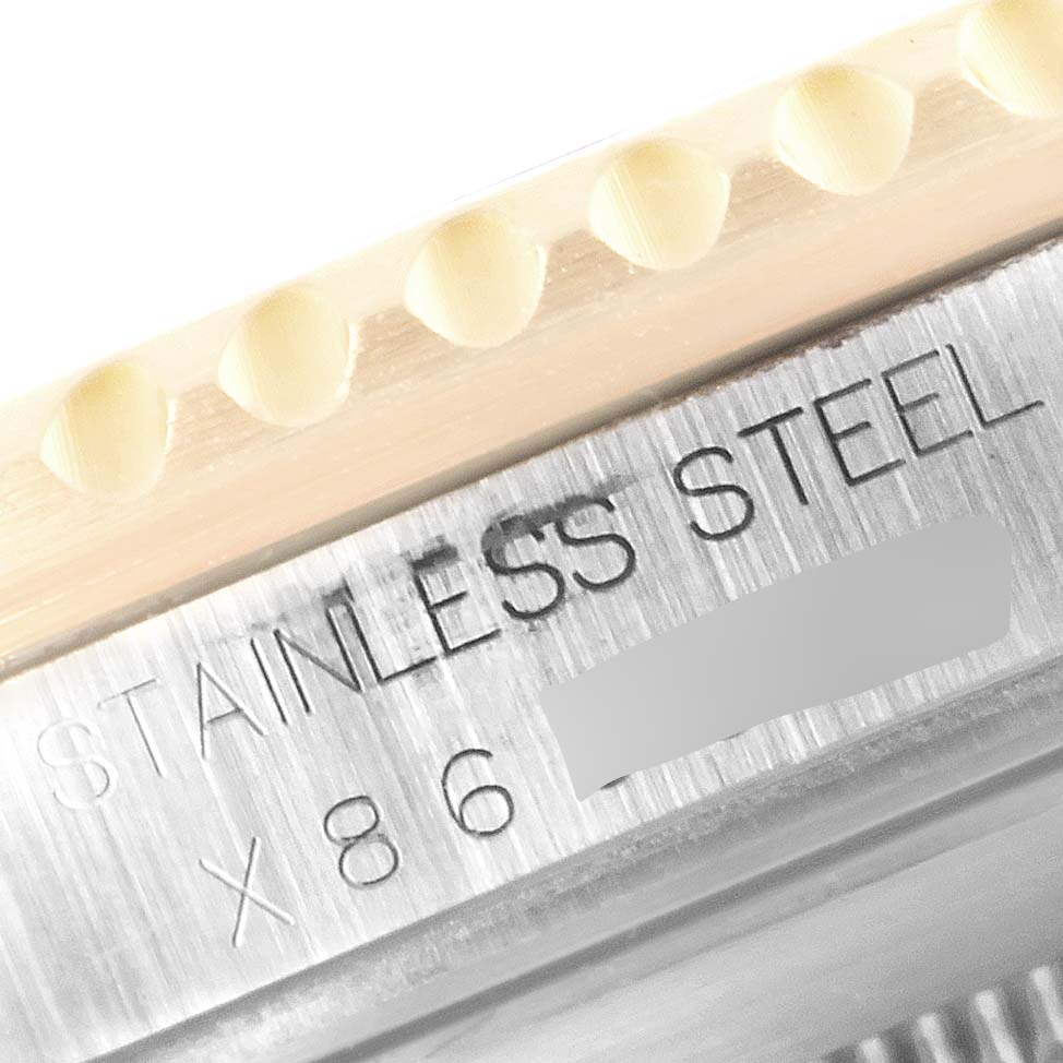 The close-up image shows the engraved "STAINLESS STEEL" text and part of the bezel of a Rolex Submariner 16613 Men
s Steel and Gold (two tone) Blue Dial 16613 Men
s Steel and Gold (two tone) Blue Dial watch.