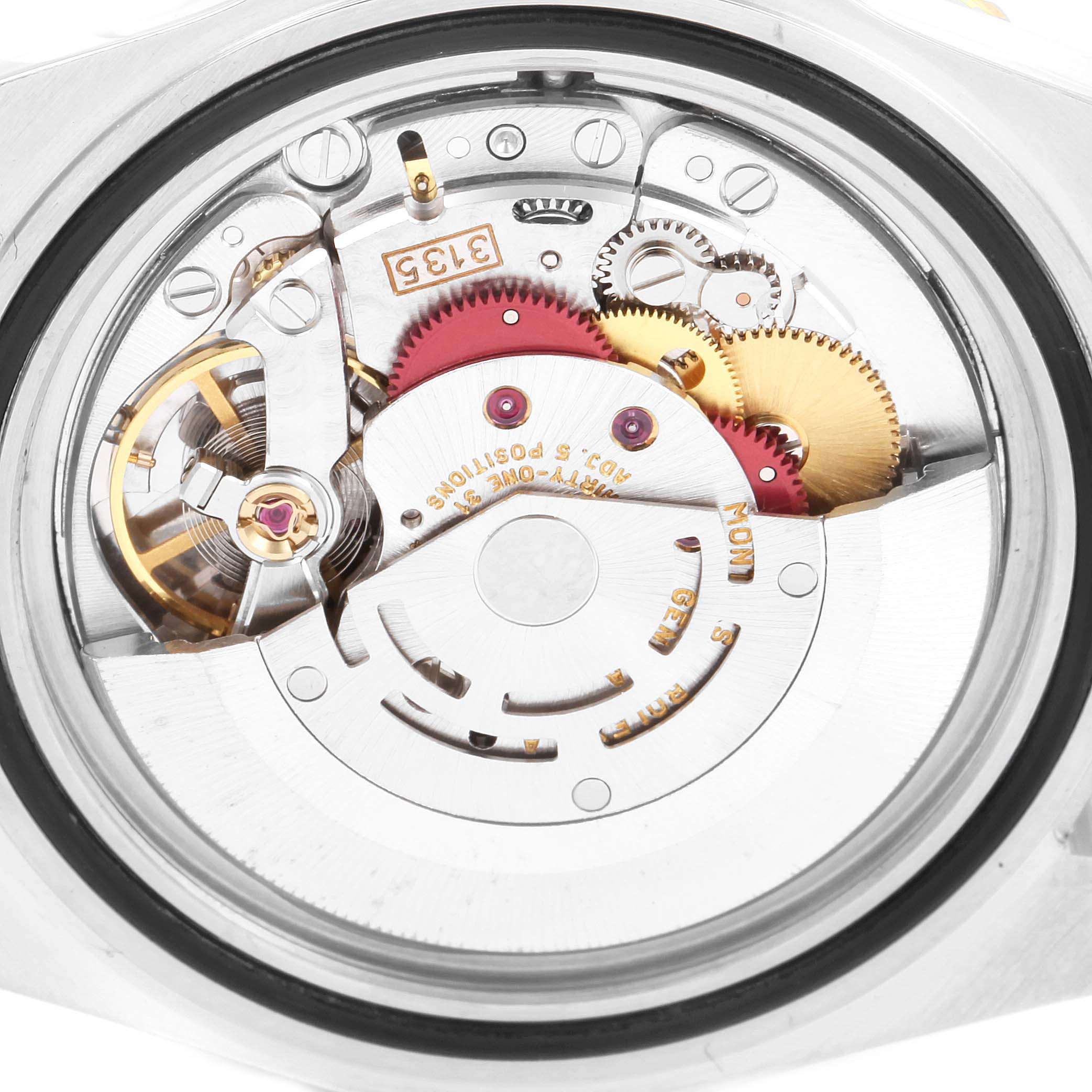 The image shows a close-up of the movement and internal mechanism of a Rolex Submariner 16613 Men
s Steel and Gold (two tone) Blue Dial 16613 Men
s Steel and Gold (two tone) Blue Dial watch.