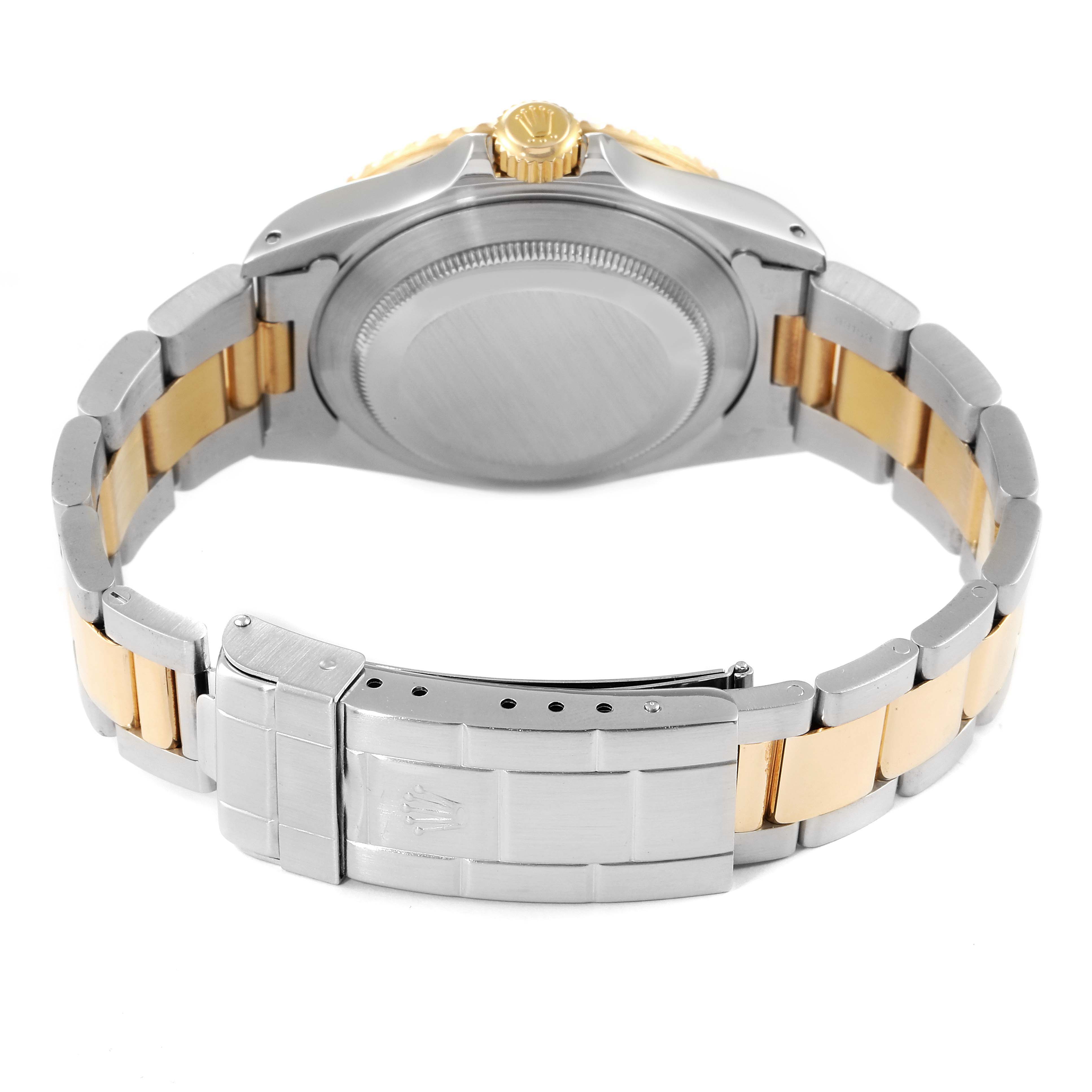 This image shows the back view of a Rolex Submariner 16613 Men
s Steel and Gold (two tone) Blue Dial 16613 Men
s Steel and Gold (two tone) Blue Dial watch, highlighting the case back and metal bracelet.