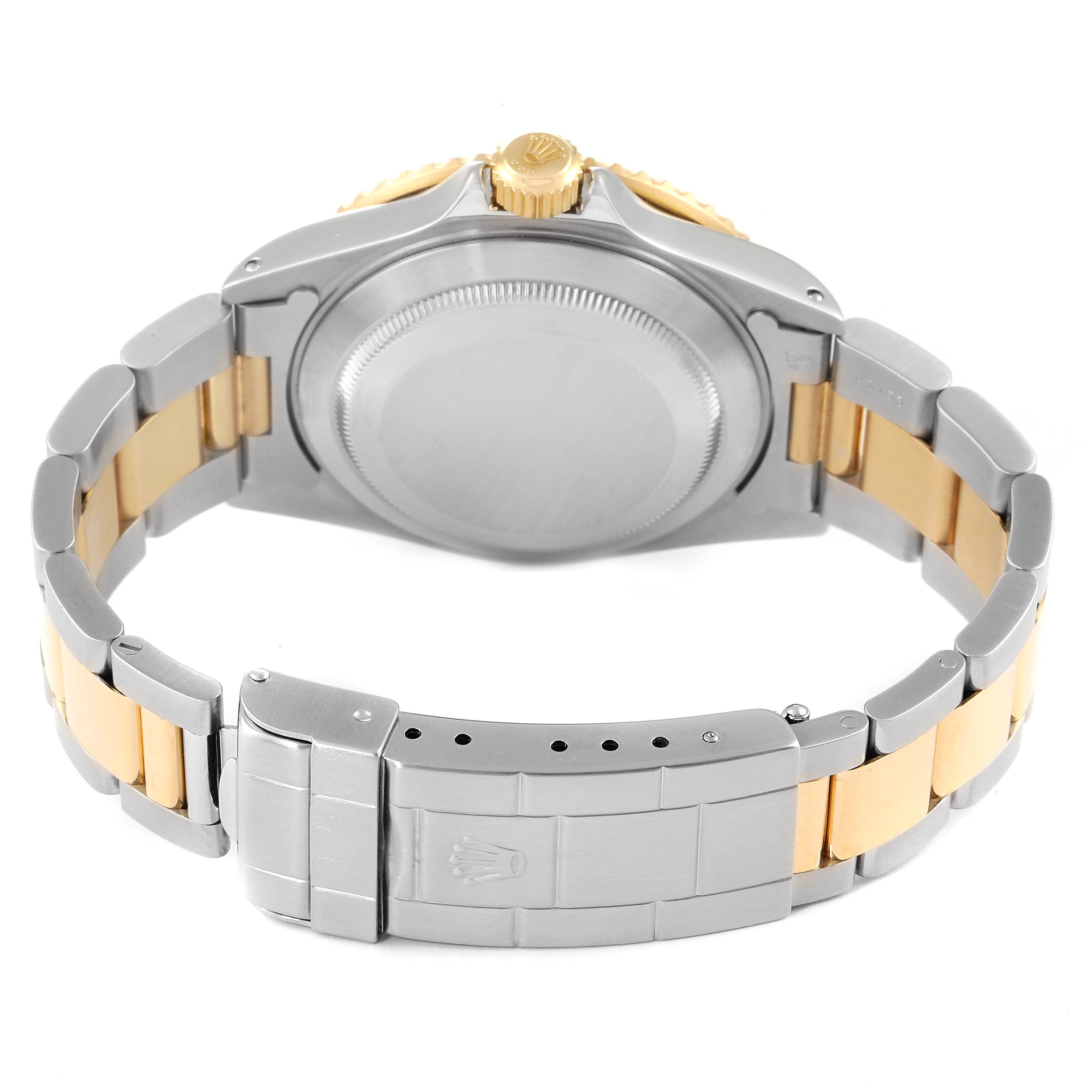 This image shows the back view of a Rolex Submariner 16613 Men
s Steel and Gold (two tone) Blue Dial 16613 Men
s Steel and Gold (two tone) Blue Dial watch, highlighting its clasp, case back, and bracelet.