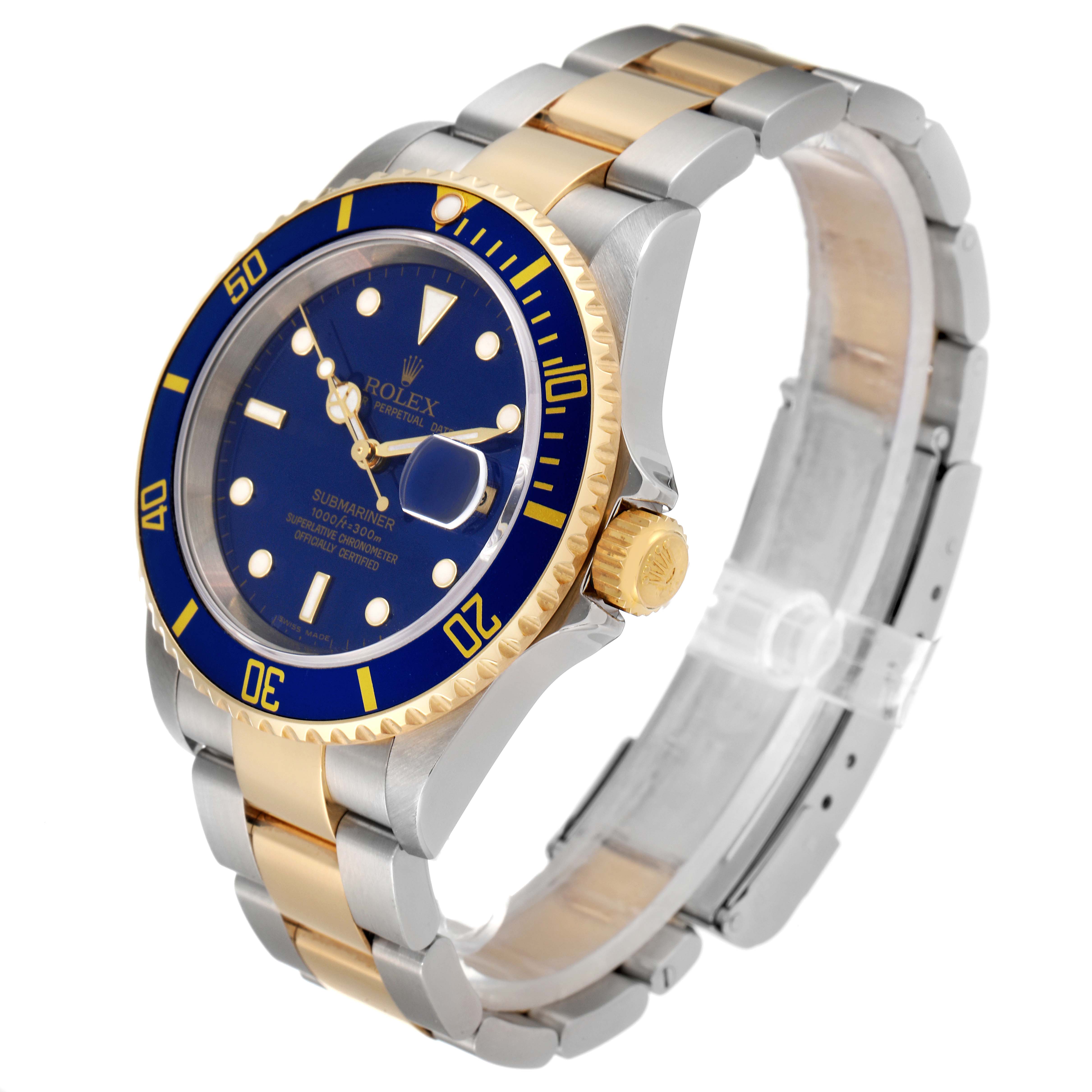 The Rolex Submariner 16613 Men's Steel and Gold (two tone) Blue Dial 16613 Men's Steel and Gold (two tone) Blue Dial watch is shown at an oblique angle, highlighting its blue dial, gold crown, and two-tone bracelet.